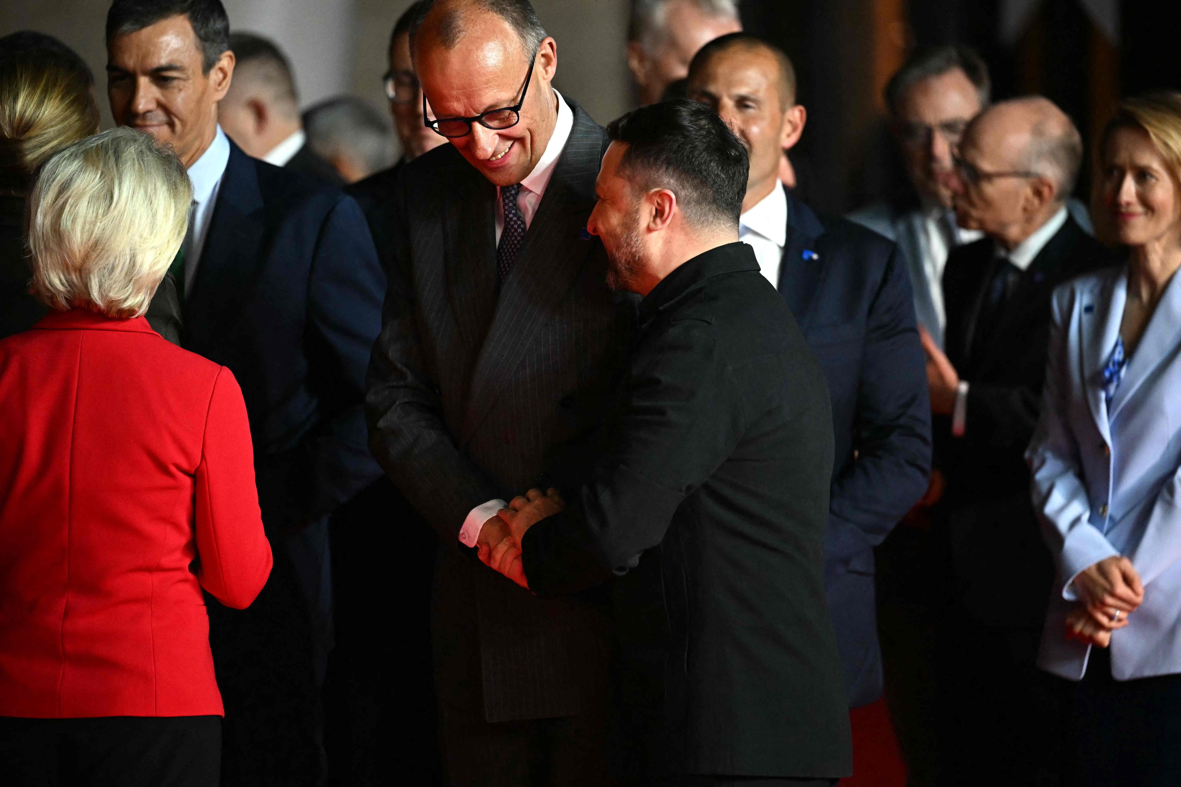 Germany’s Chancellor Friedrich Merz (middle) shakes hands with Ukraine’s President Volodymyr Zelensky ahead of an informal meeting of the European Council, in Ayia Napa on Thursday. Photo: AFP