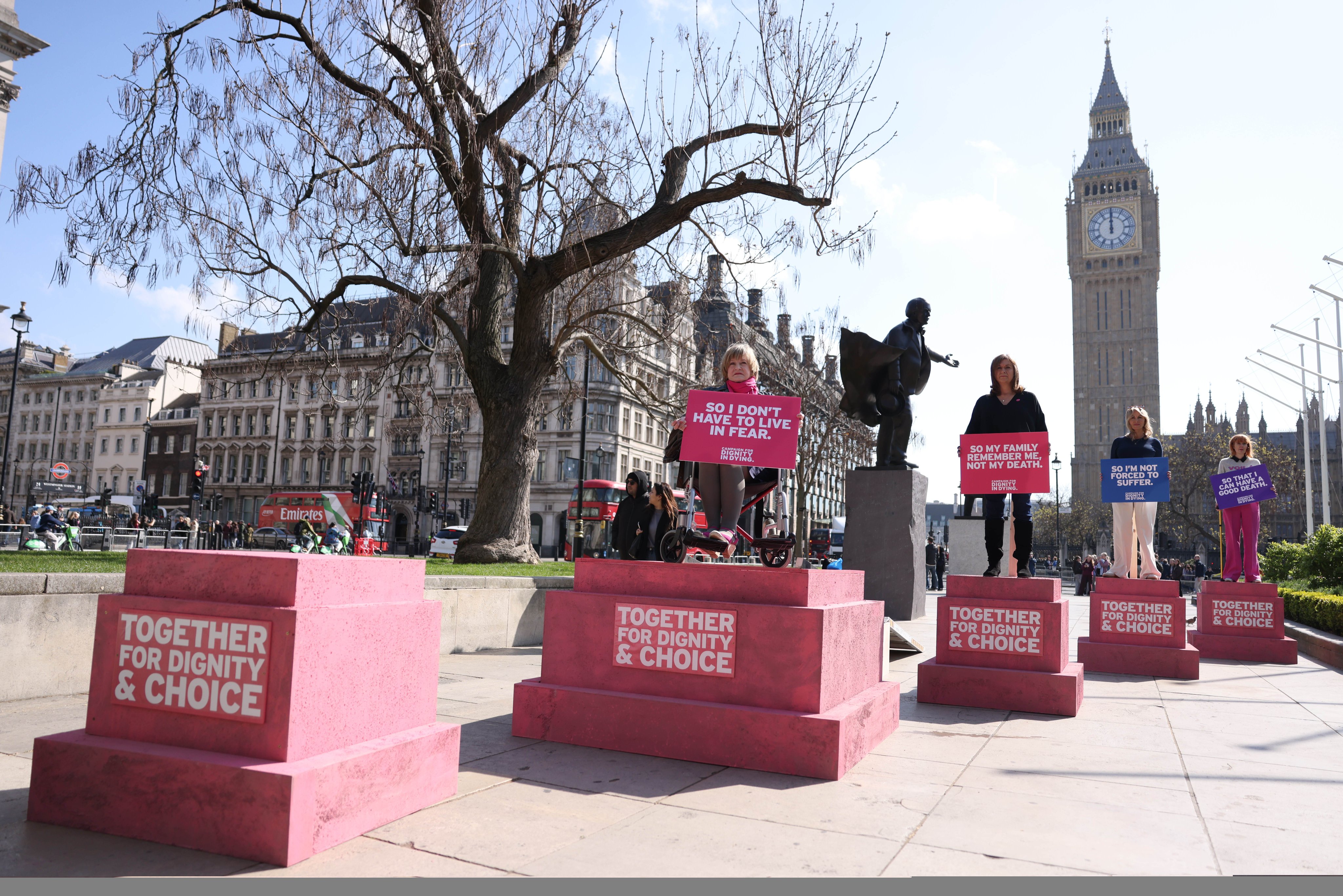 People protest for the assisted dying bill outside parliament in London on Wednesday. Photo: EPA