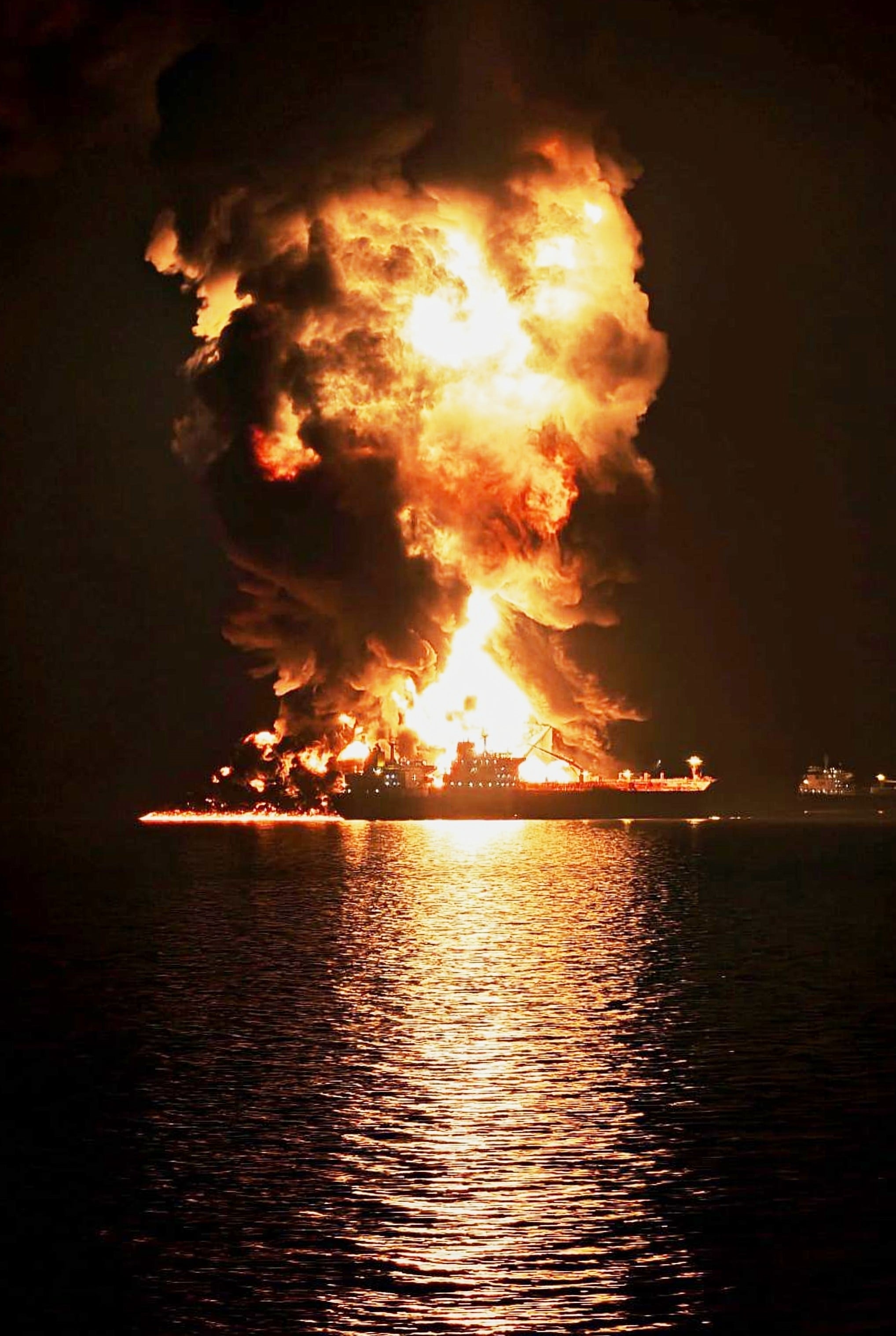 An oil tanker burns off the coast of Iraq after being hit by an Iranian strike last month amid the US-Israel war on Iran. Photo: AP