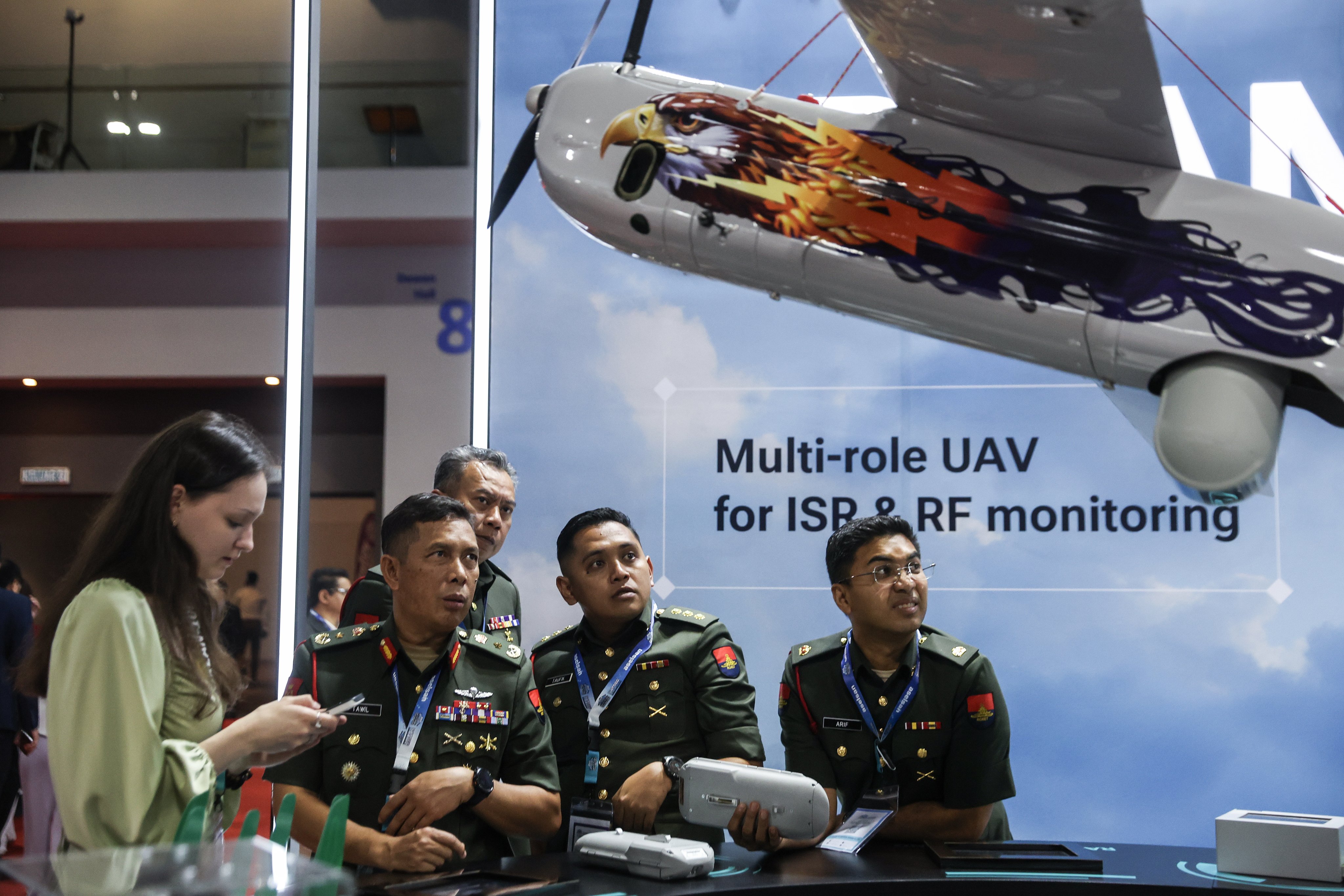 Malaysian army officers visit the booth of Special Technology Control, a Russian developer of unmanned systems, at the Defence Services Asia exhibition in Kuala Lumpur, Malaysia, on Tuesday. Photo: EPA