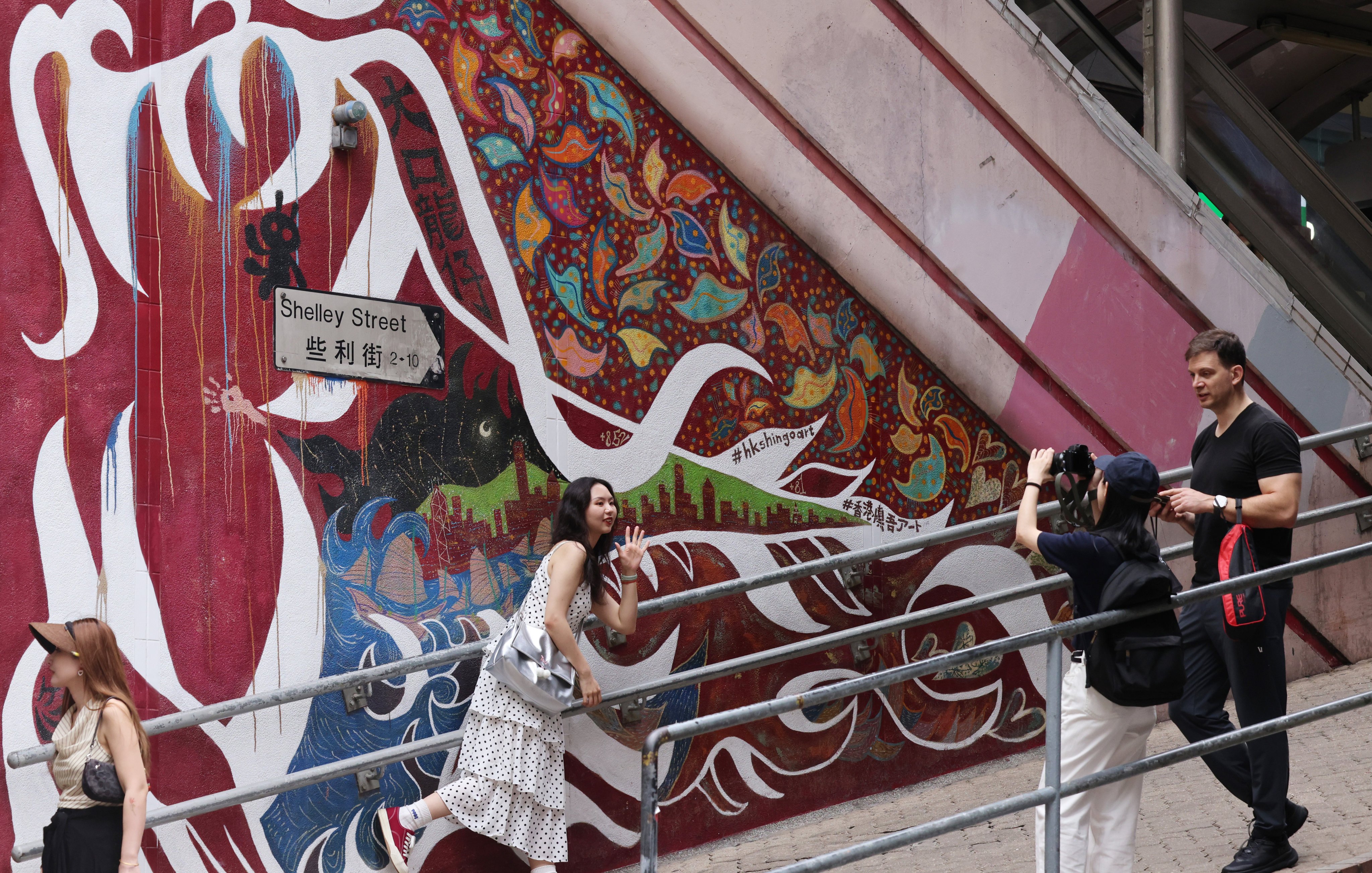 Visitors in Central. The initiative is aimed at encouraging tourists to explore the art, historical sites, local culture and delicacies of Central and Sheung Wan. Photo: Jelly Tse