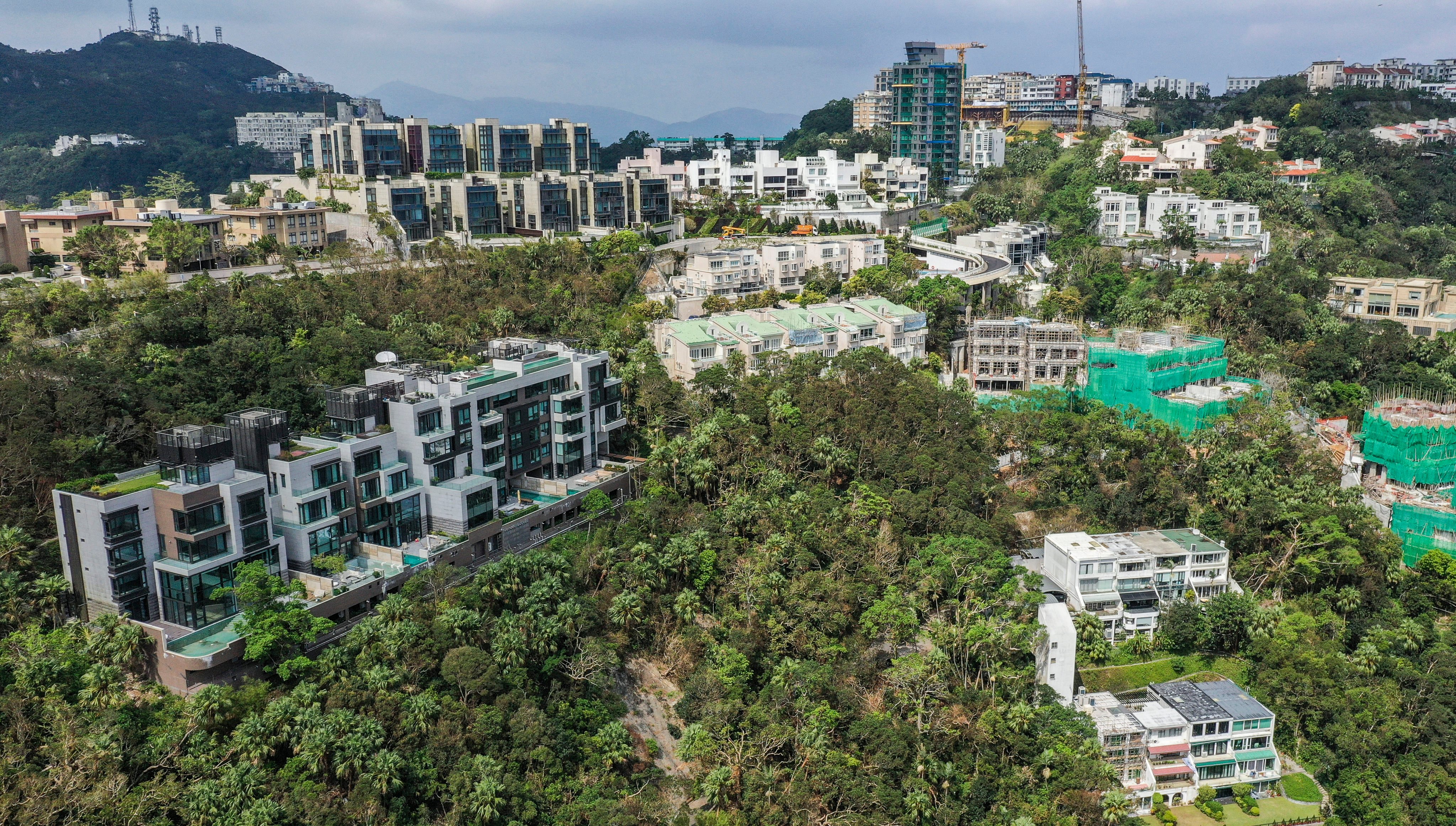 Luxury homes and residential buildings on Mount Kellett Road, The Peak. Photo: Roy Issa