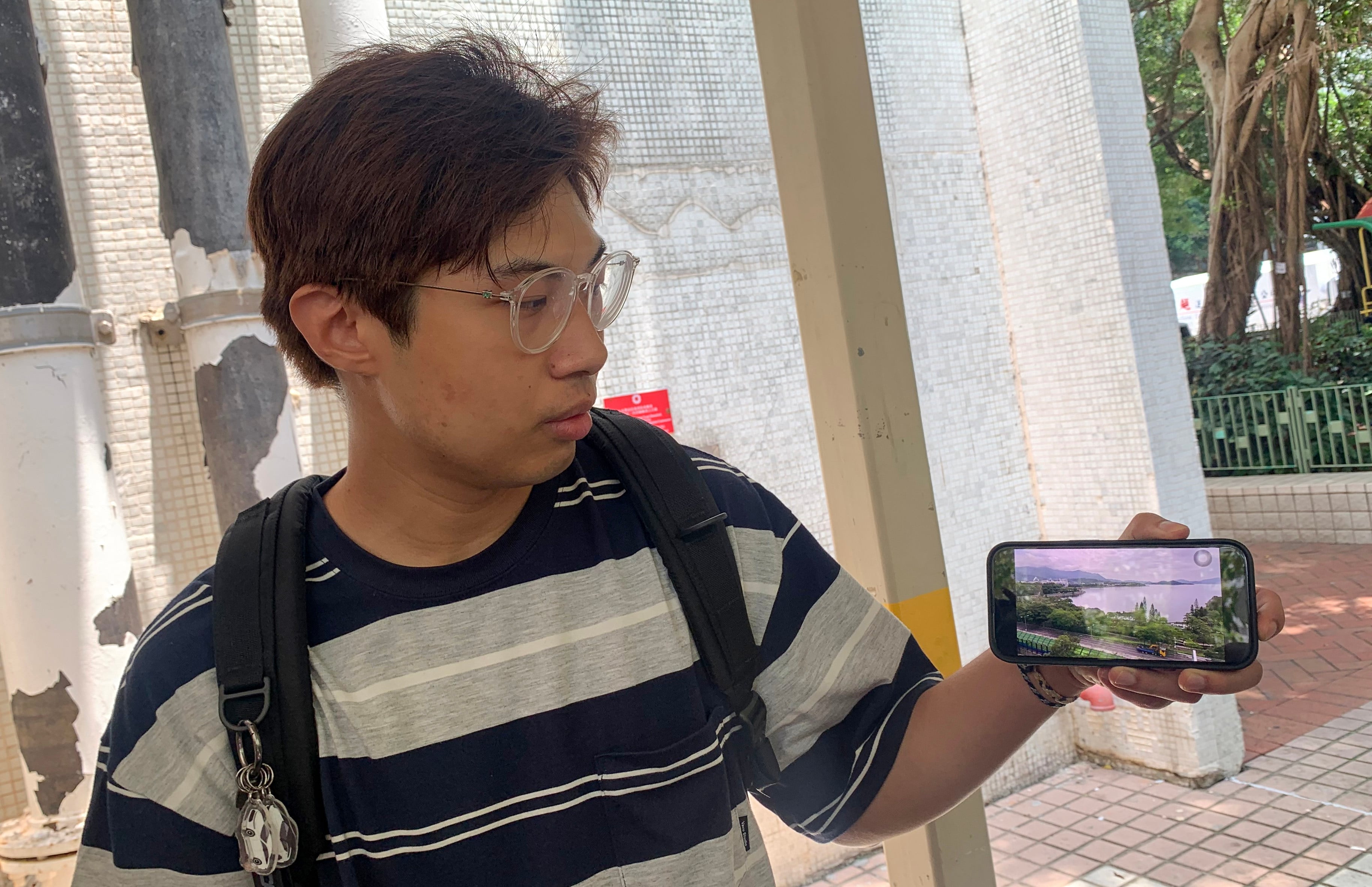 Ian Chu, who took the chance to take a final photo of the Tolo Harbour view from his flat. Photo: Theodora Yu