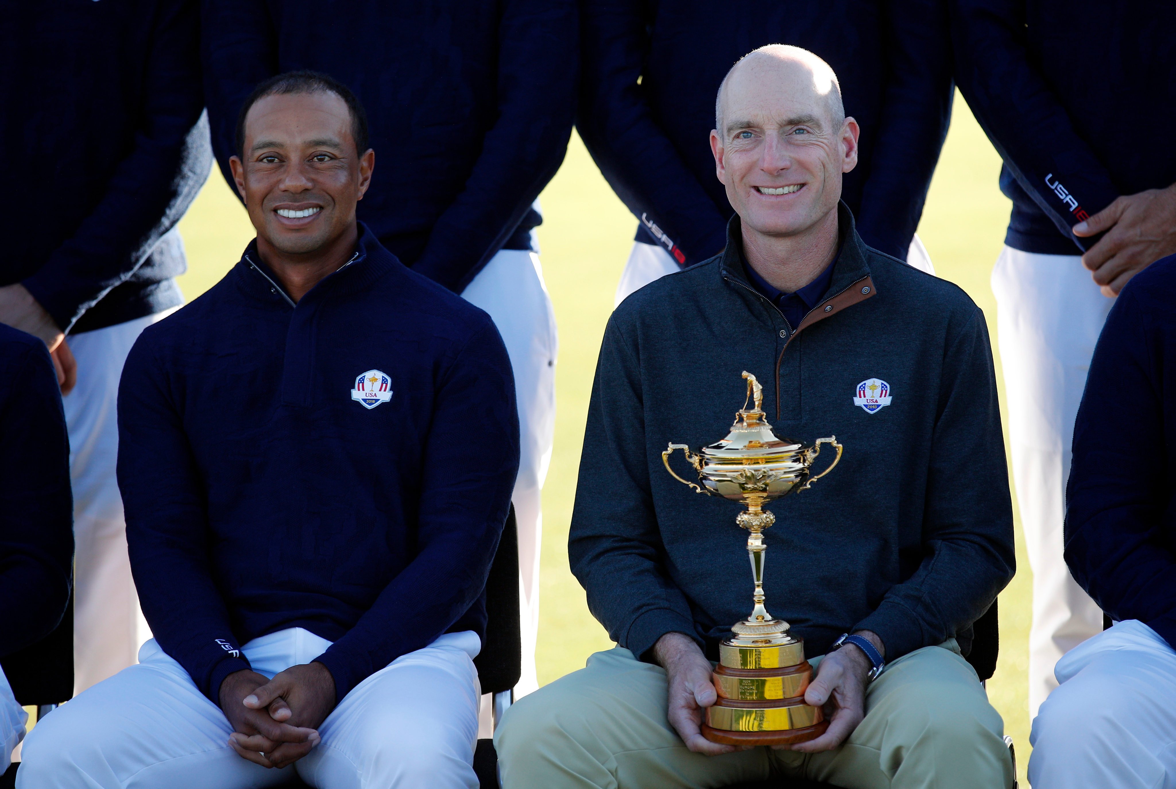 Jim Furyk (holding the trophy) and Tiger Woods before unsuccessfully defending the Ryder Cup in France in 2018. Photo: AP