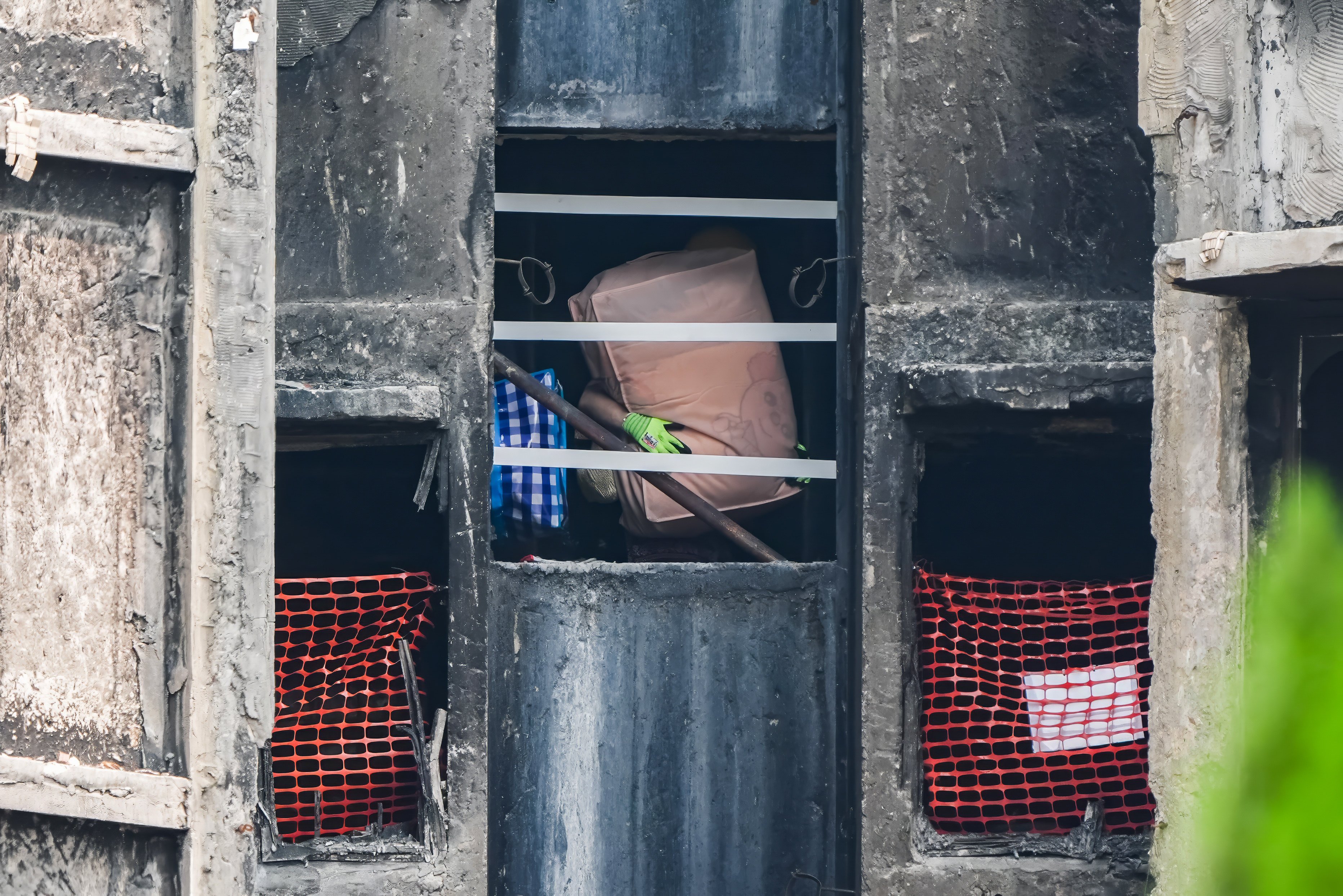 A resident collects personal belongings from Wang Sun House. Photo: Eugene Lee