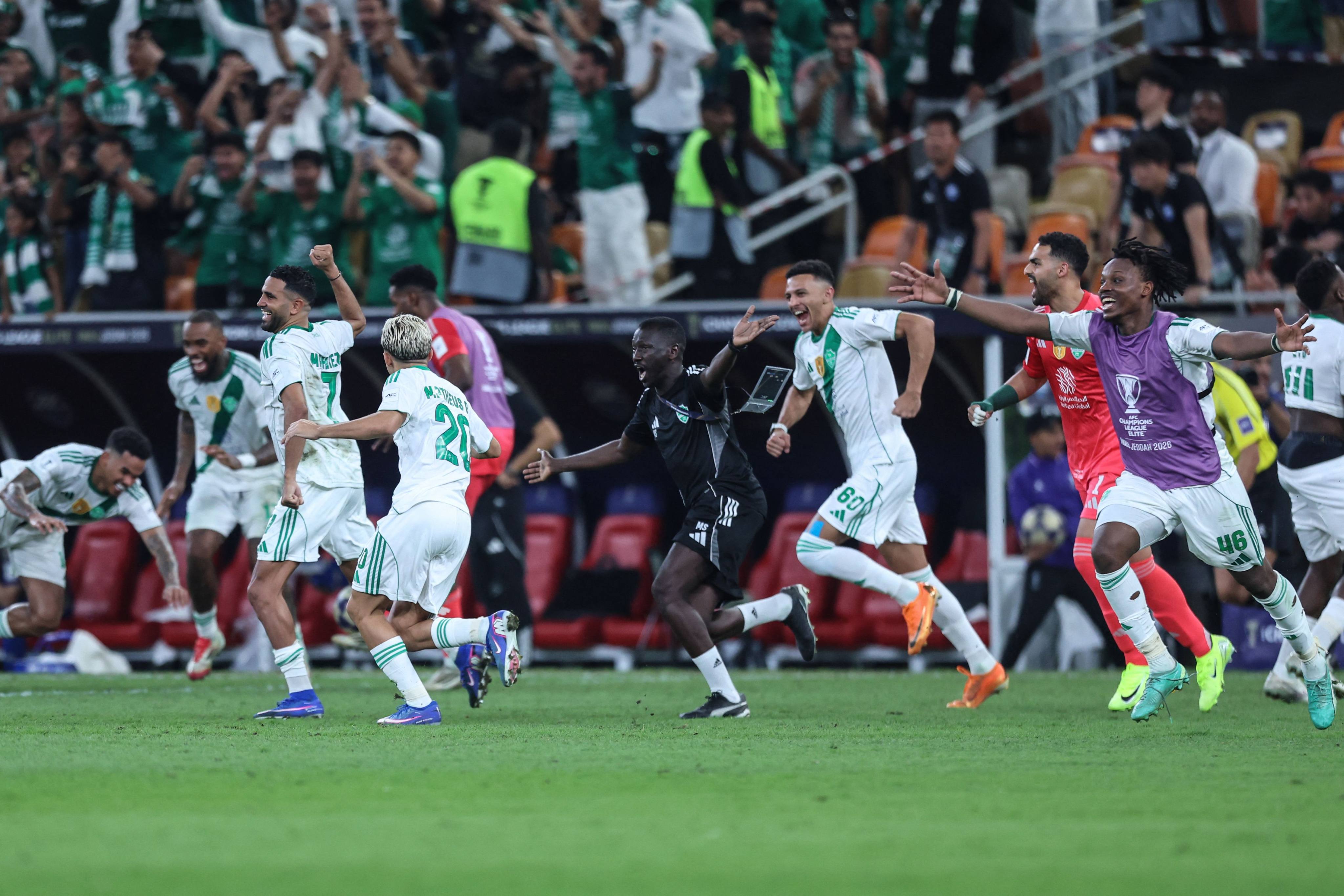 Al-Ahli players and staff celebrate beating Machida Zelvia in the AFC Champions League Elite final. Photo: AFP