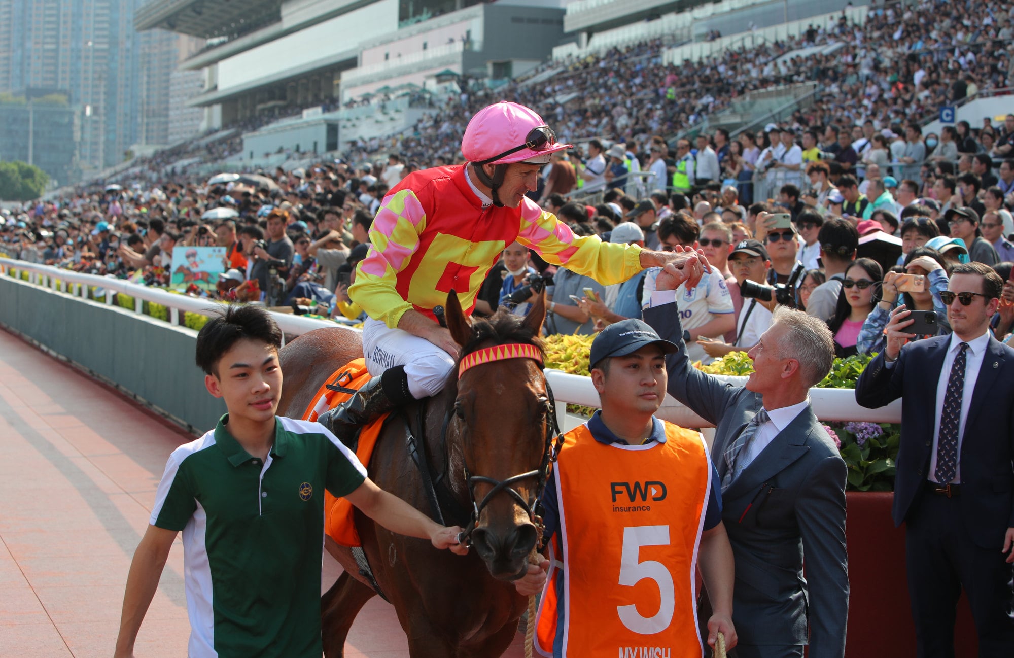 Hugh Bowman and Mark Newnham celebrate My Wish's Group One win.