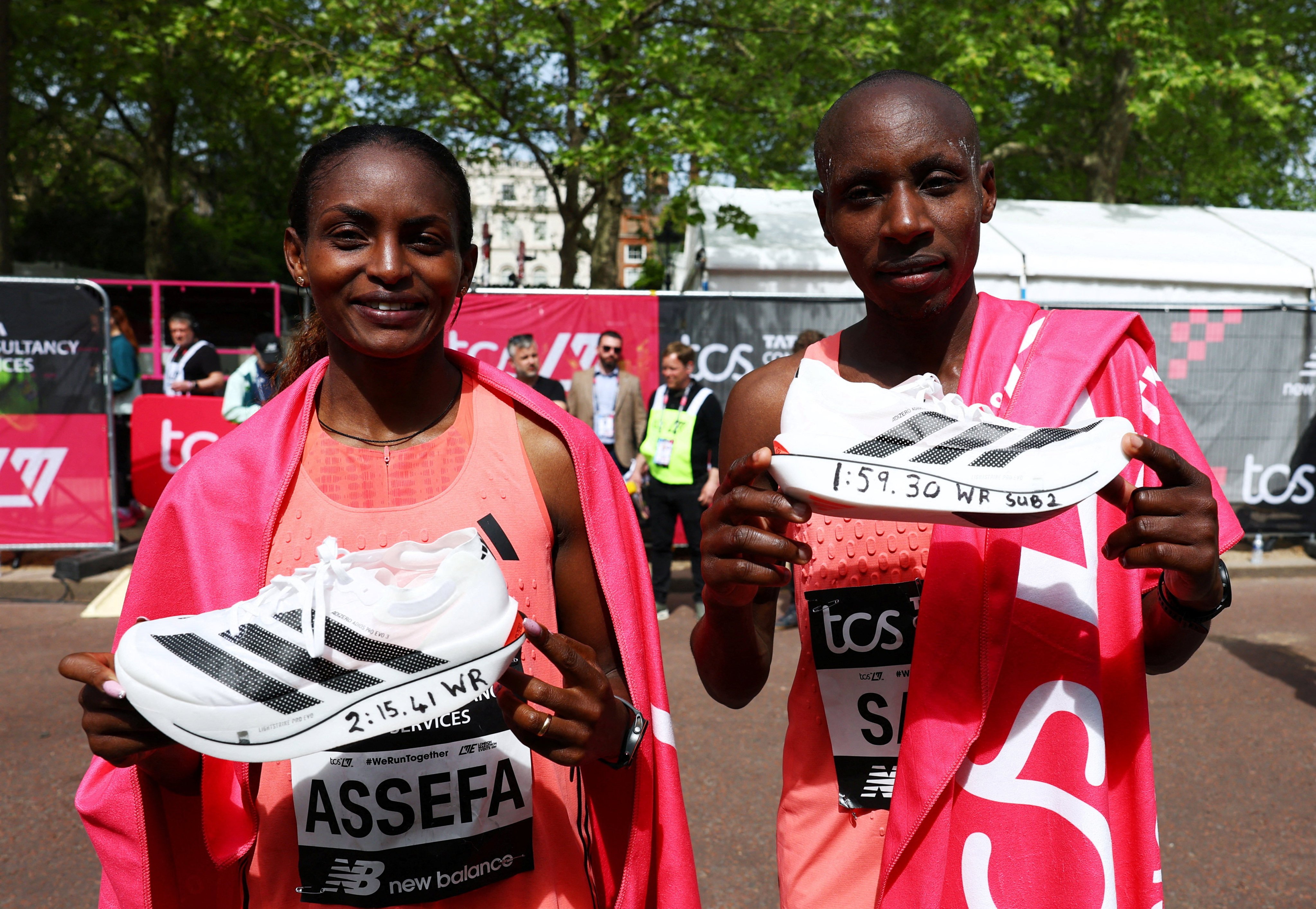 Ethiopia’s Tigst Assefa (left) and Kenya’s Sabastian Sawe with their Adidas Adizero Adios Pro Evo 3 shoes after winning and setting world records at the London Marathon on Sunday. Photo: Reuters