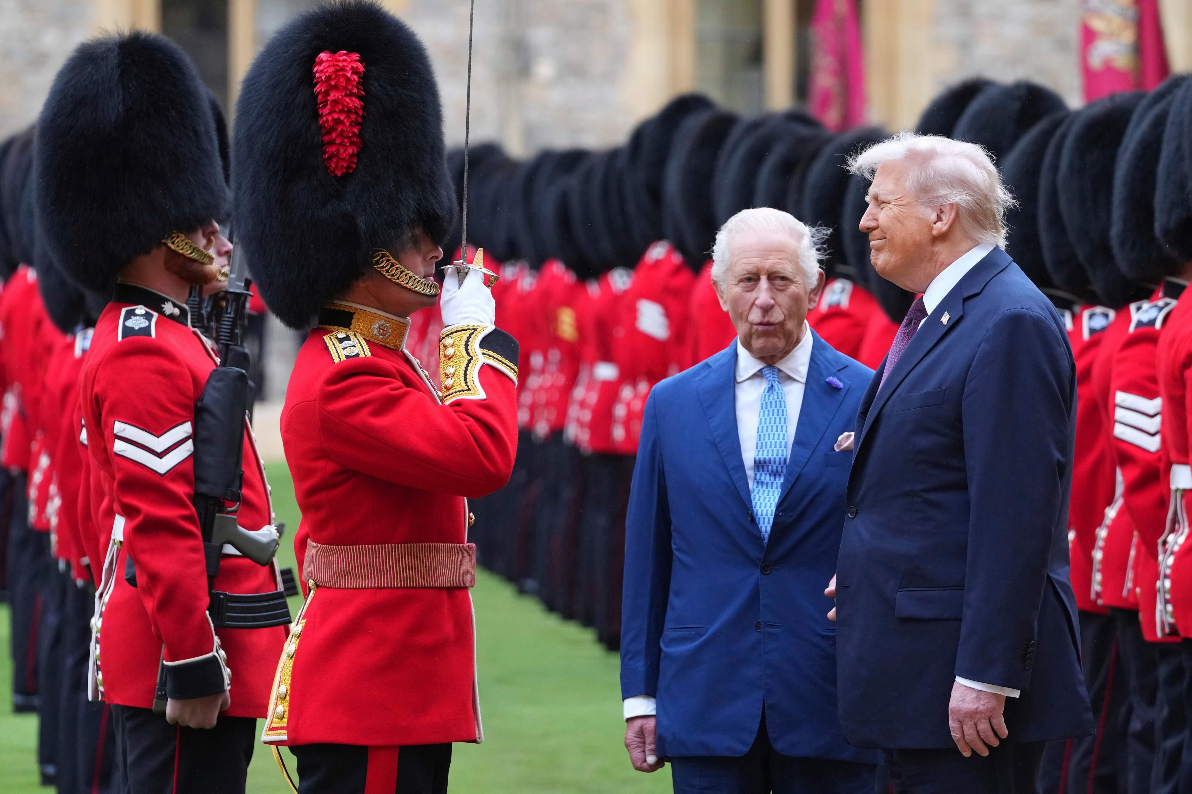 US President Donald Trump, right, and Britain’s King Charles review the Guard of Honour at Windsor Castle in England in September.  Photo: AP