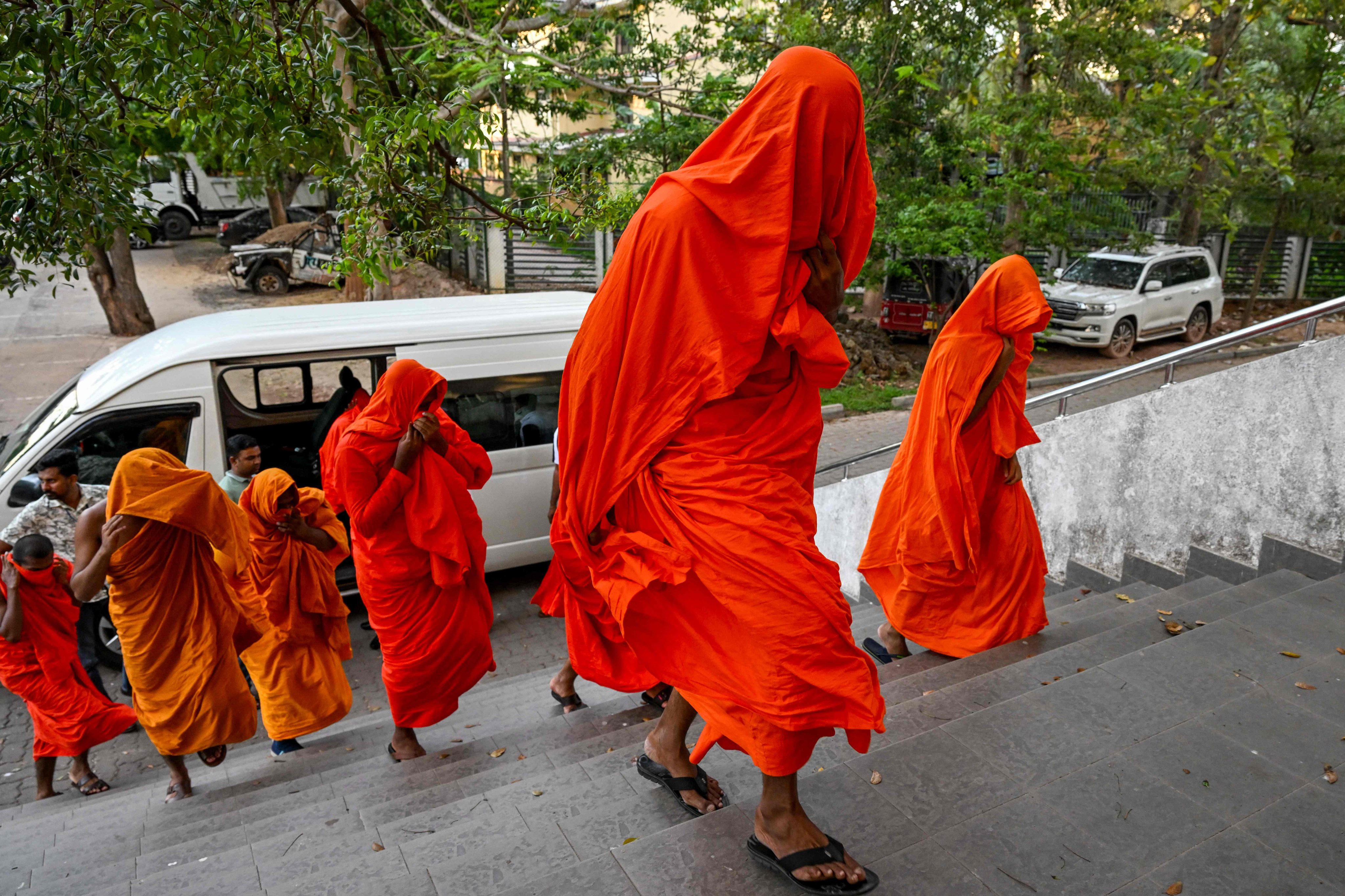 Sri Lankan monks arrive at court after their arrest in Negombo on Sunday. Photo: AFP