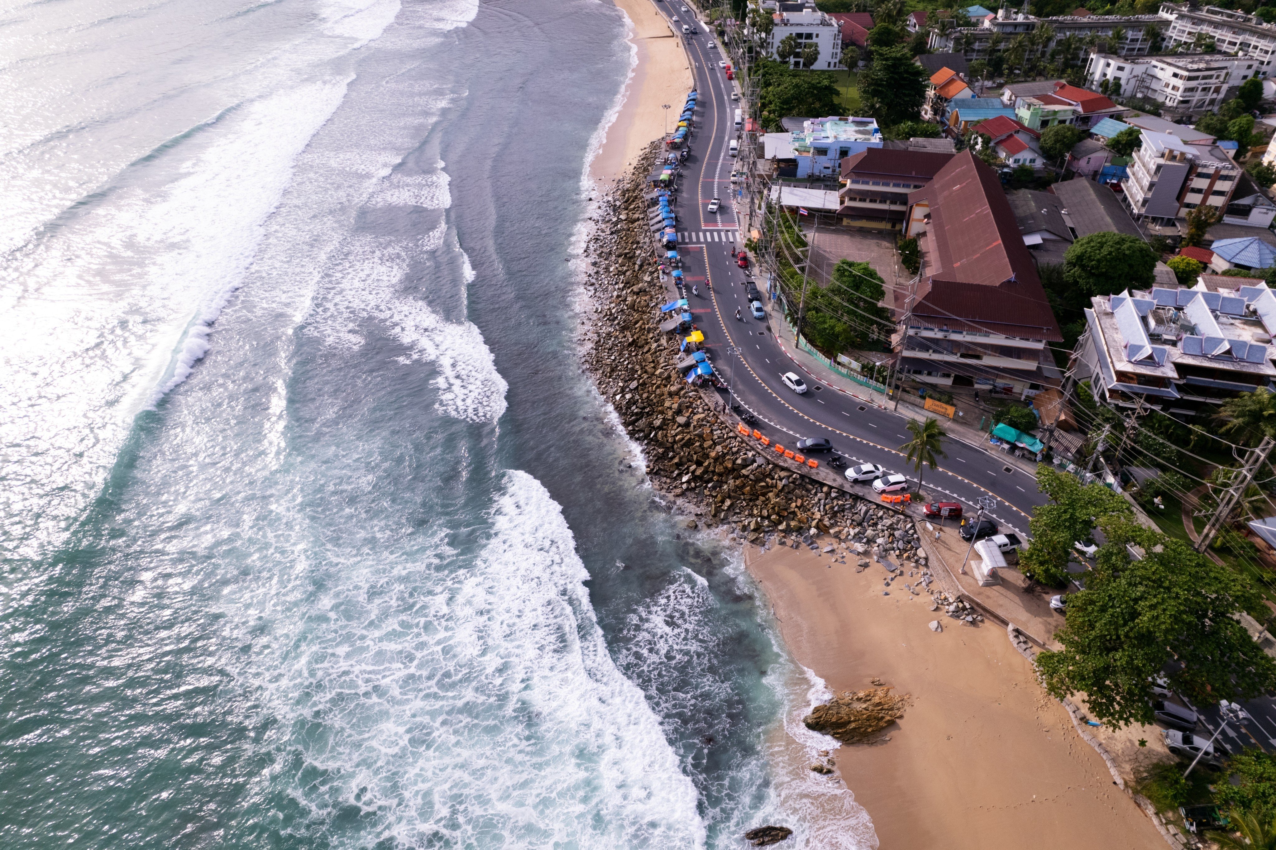 Waves crash on Kalim beach in Phuket. The suspect was arrested from a luxury resort on the Thai island. Photo: Shutterstock