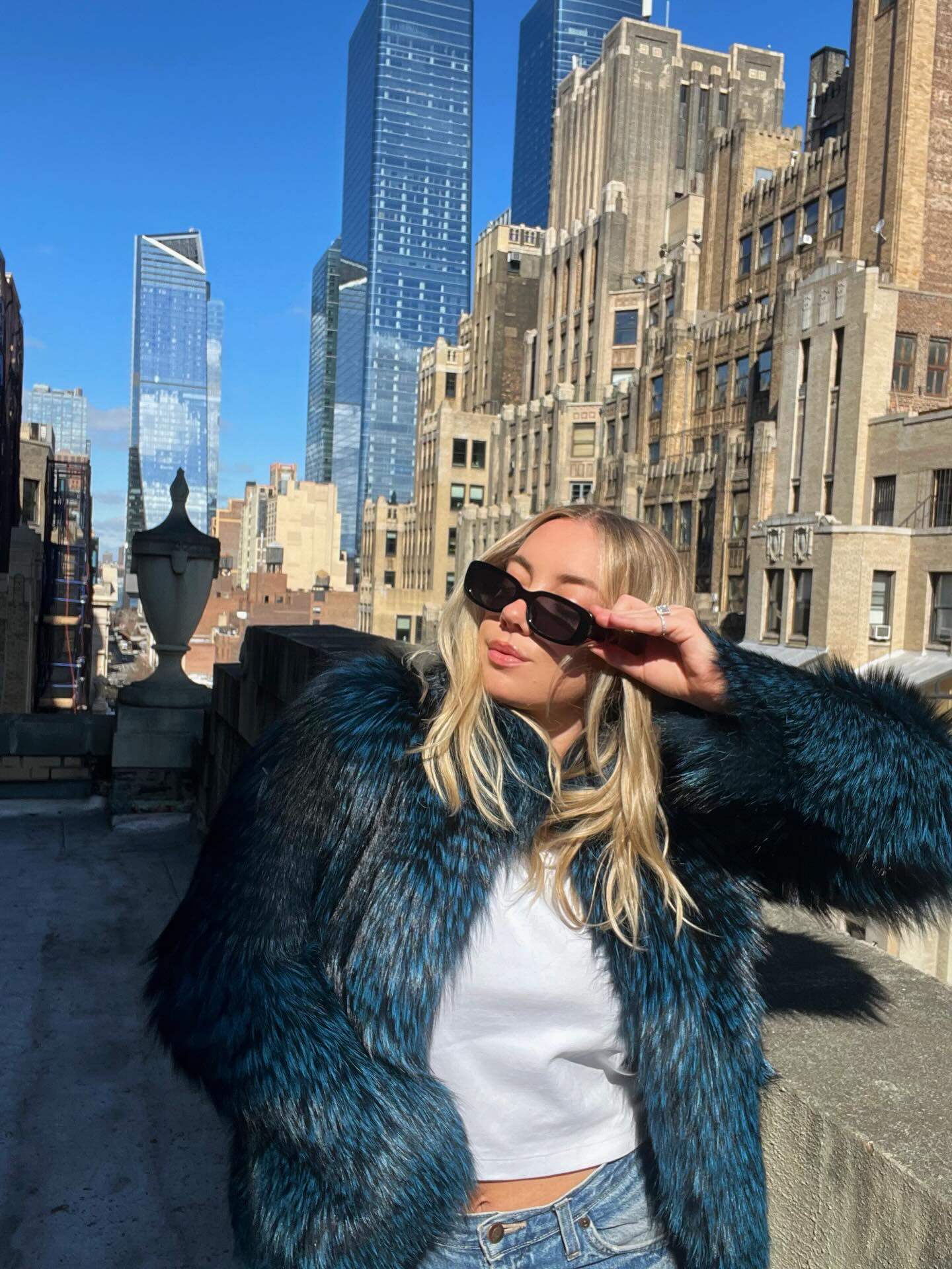 Cowits niece poses wearing a fur coat, recalling “mob wife” fashion. Photo: Instagram/madisonavefurs