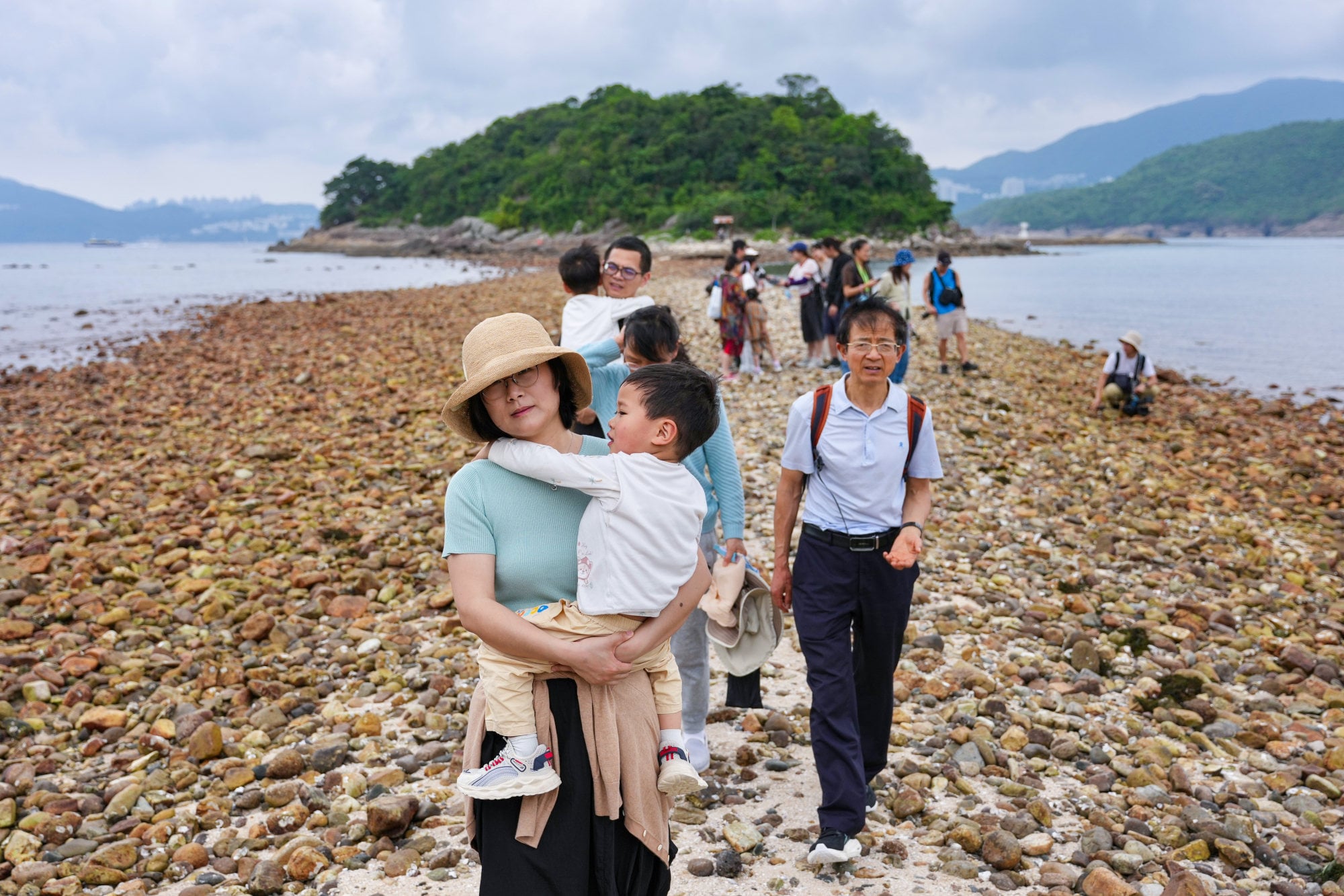 Tourist Zheng Man (front) was visiting the island with her family. Photo: Karma Lo