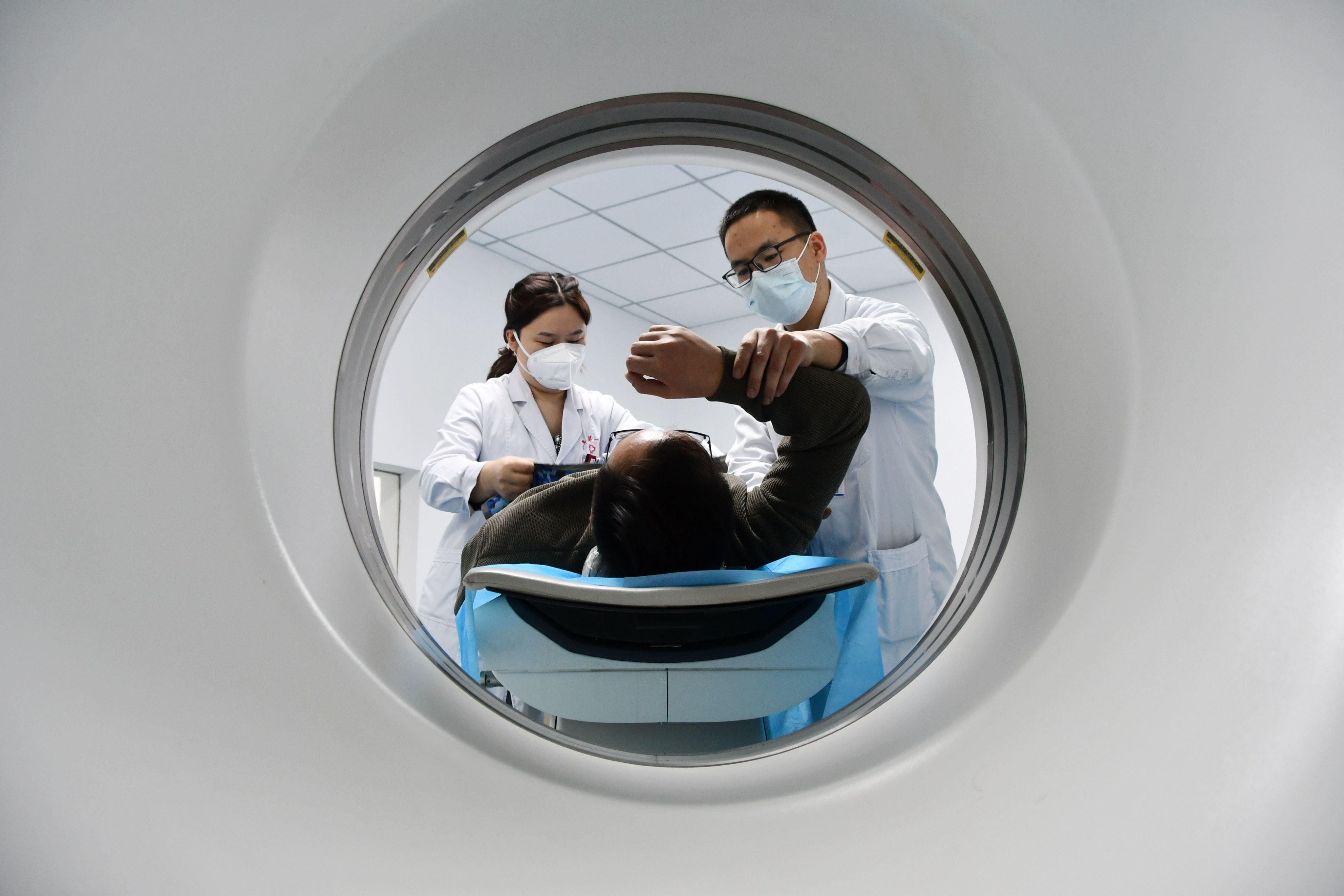 Doctors prepare a patient for a CT scan at a hospital in Handan city in Hebei province, January 22, 2023. Photo: Feature China/Future Publishing via Getty Images