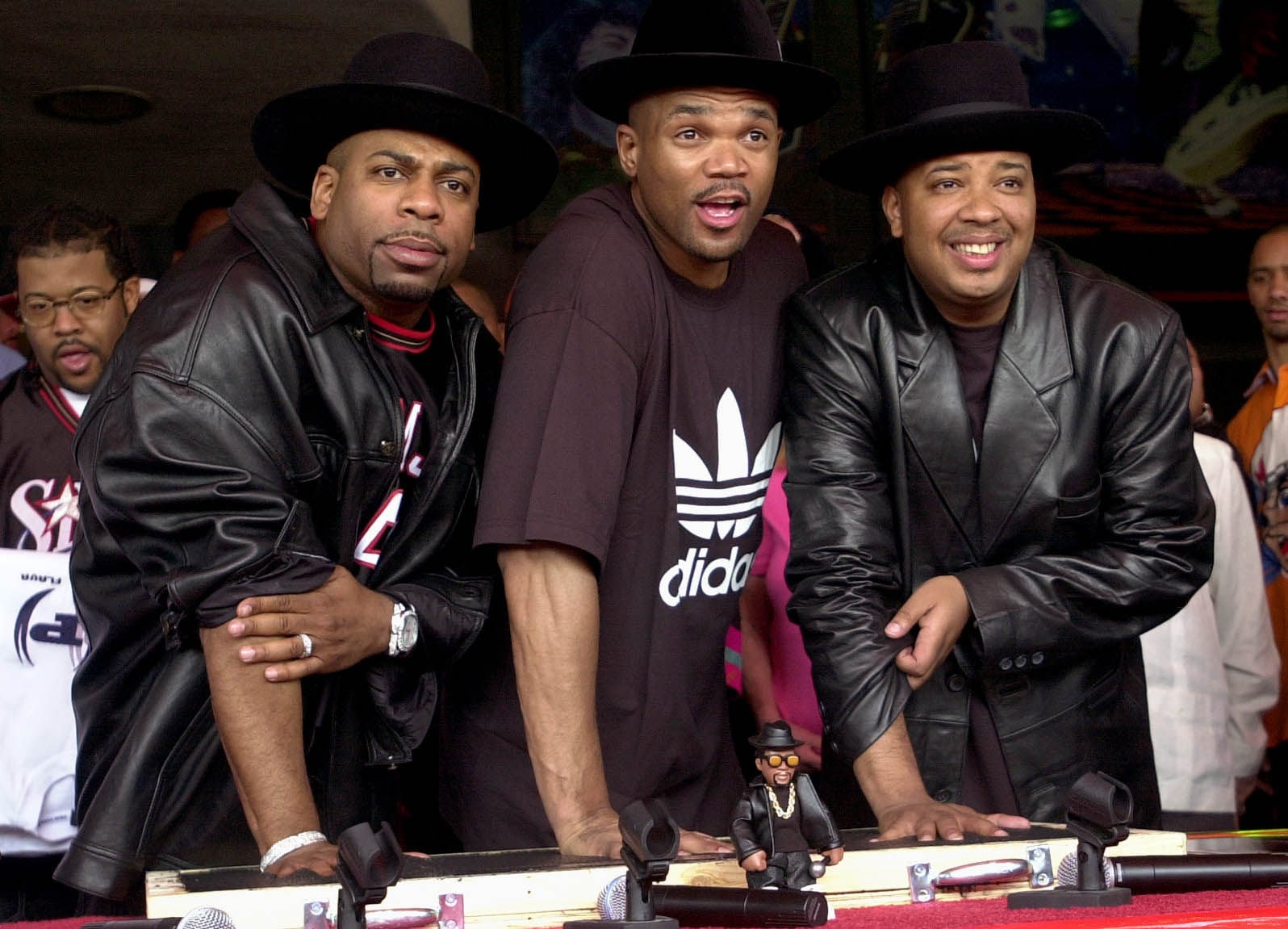 Run-DMC, from left, the late Jason “Jam Master Jay” Mizell, Darryl “DMC” McDaniels, and Joseph “DJ Run” Simmons are inducted into Hollywood’s RockWalk in Los Angeles in February 2002. Photo: AP