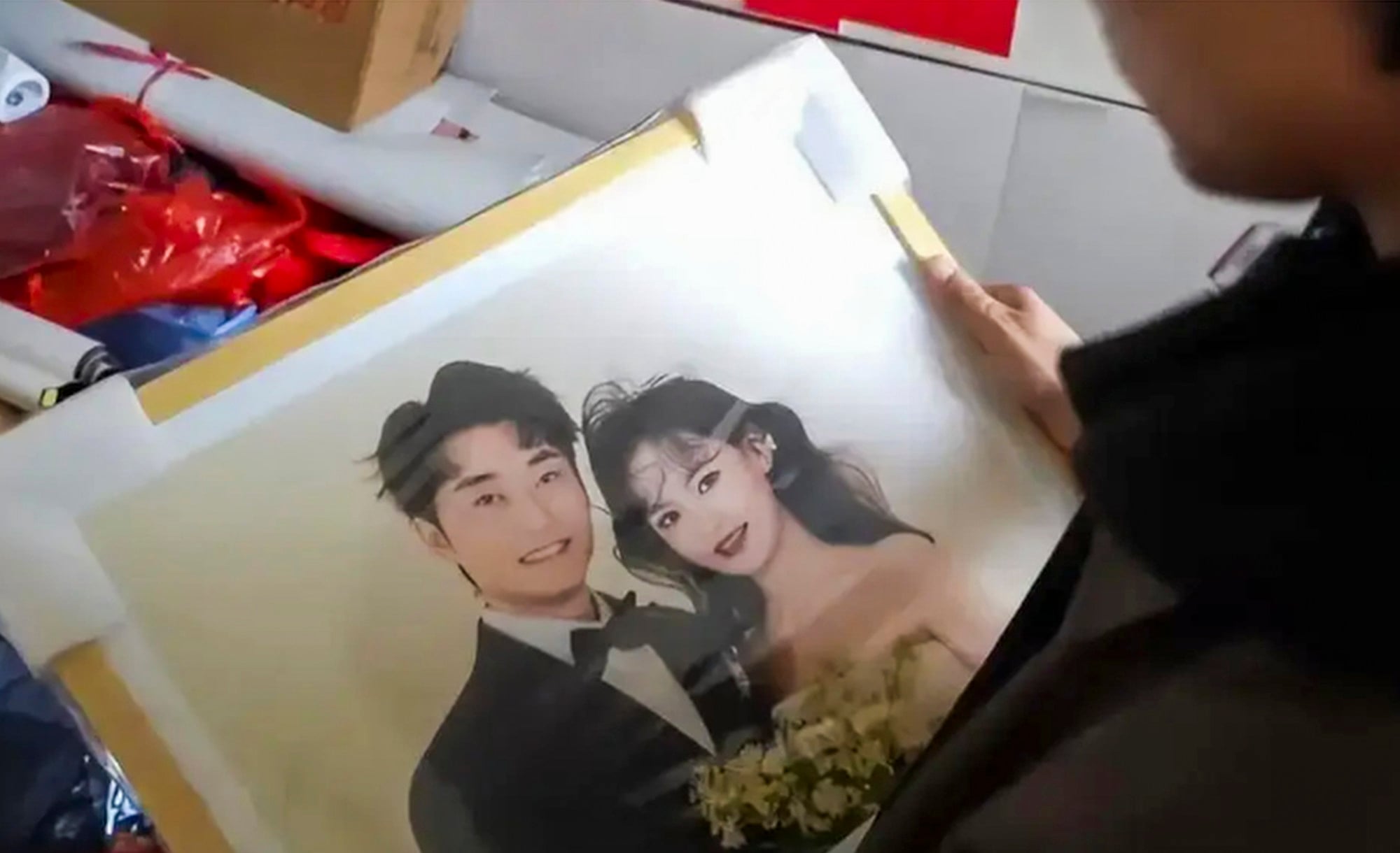 Happy together: A prized wedding photograph of the smiling couple, above. Photo: Baidu
