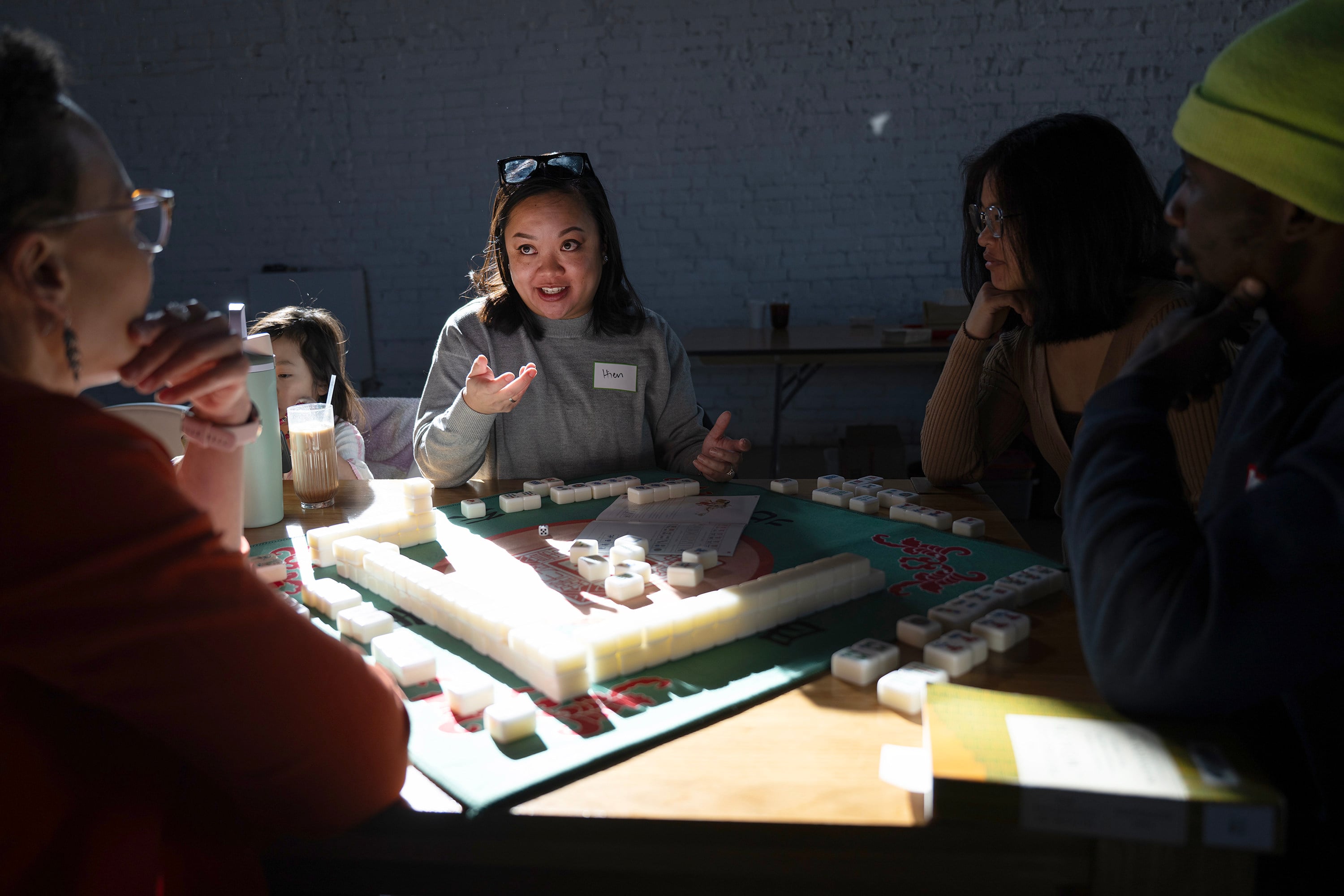 Hien Kim (centre) gives advice to the rest of her table during a monthly meeting of the Honour Tile Society mahjong club at Hot Shot Coffee in Denver, in the US. Photo: TNS