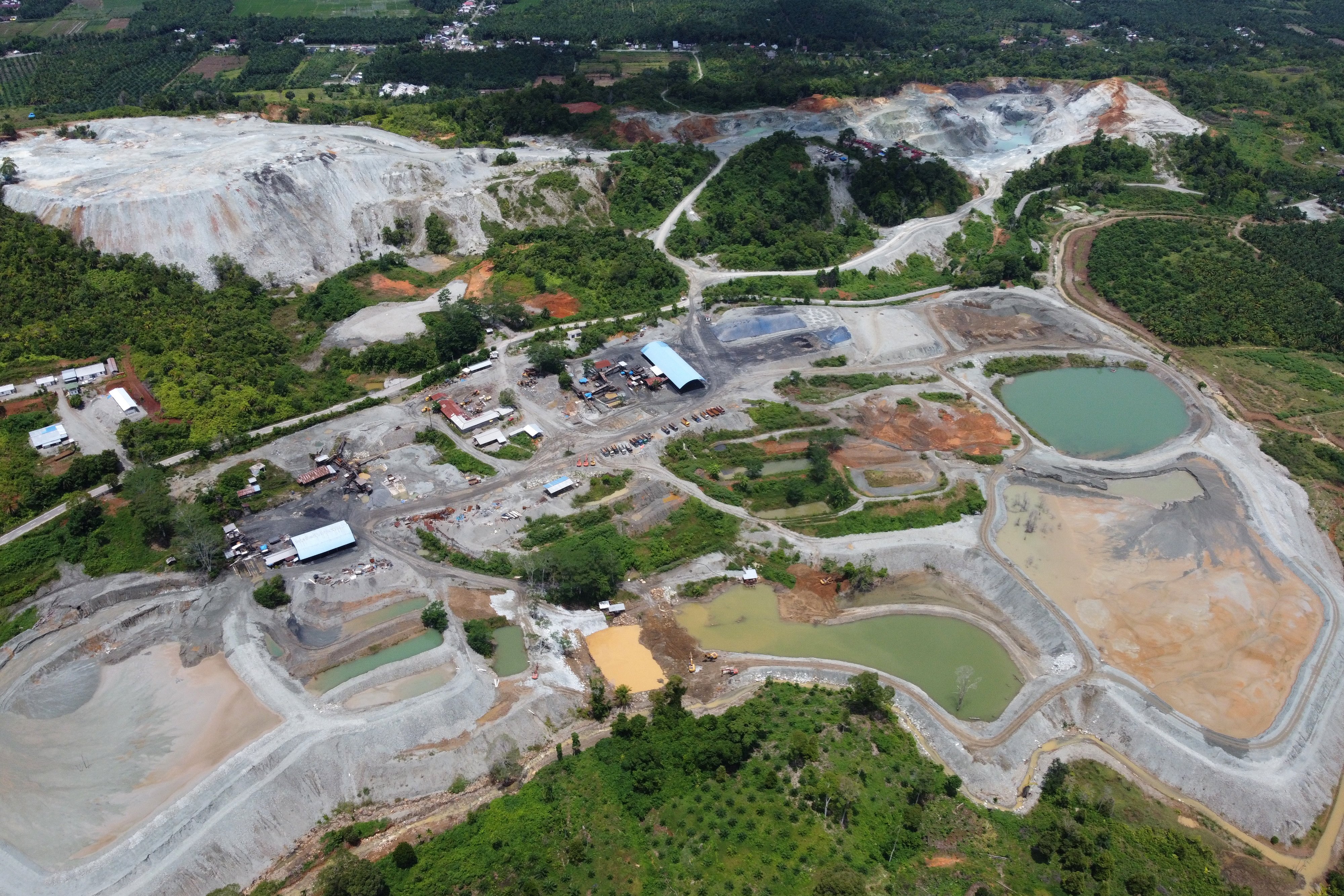 An aerial picture shows iron ore mines at the foot of Mount Leuser National Park - a cornerstone of rainforest - in Aceh, Indonesia on April 9. Photo: EPA