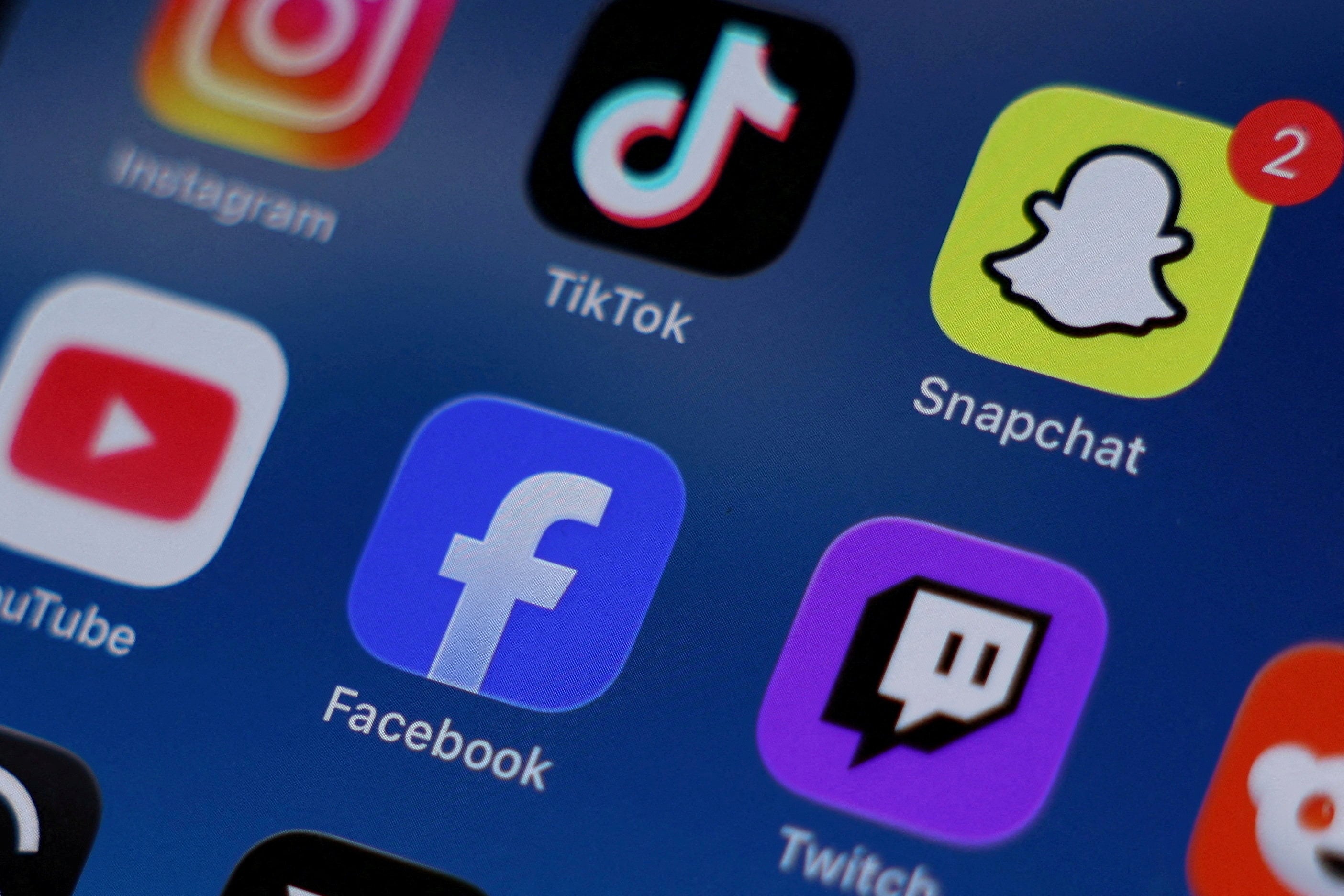 Various applications are displayed on a mobile phone, ahead of Sweden planning to fine social media firms unless they swiftly remove ‘murder ads’. Photo: Reuters