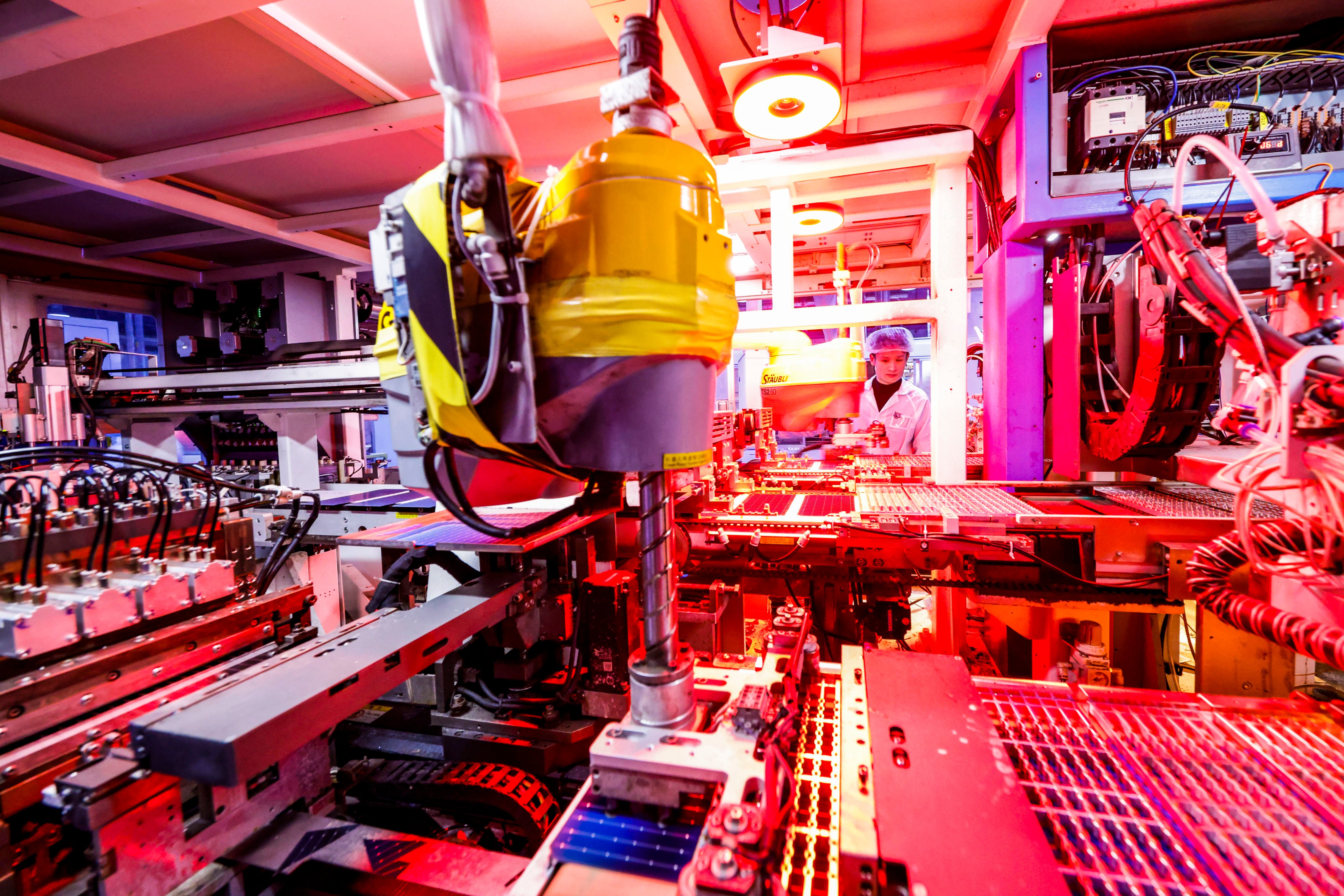 A worker produces photovoltaic modules for export at the workshop of a new-energy company in China’s Jiangsu province. Findings indicate a disproportionately high number of “zombie companies” in the nation’s renewables sector. Photo: Getty Images