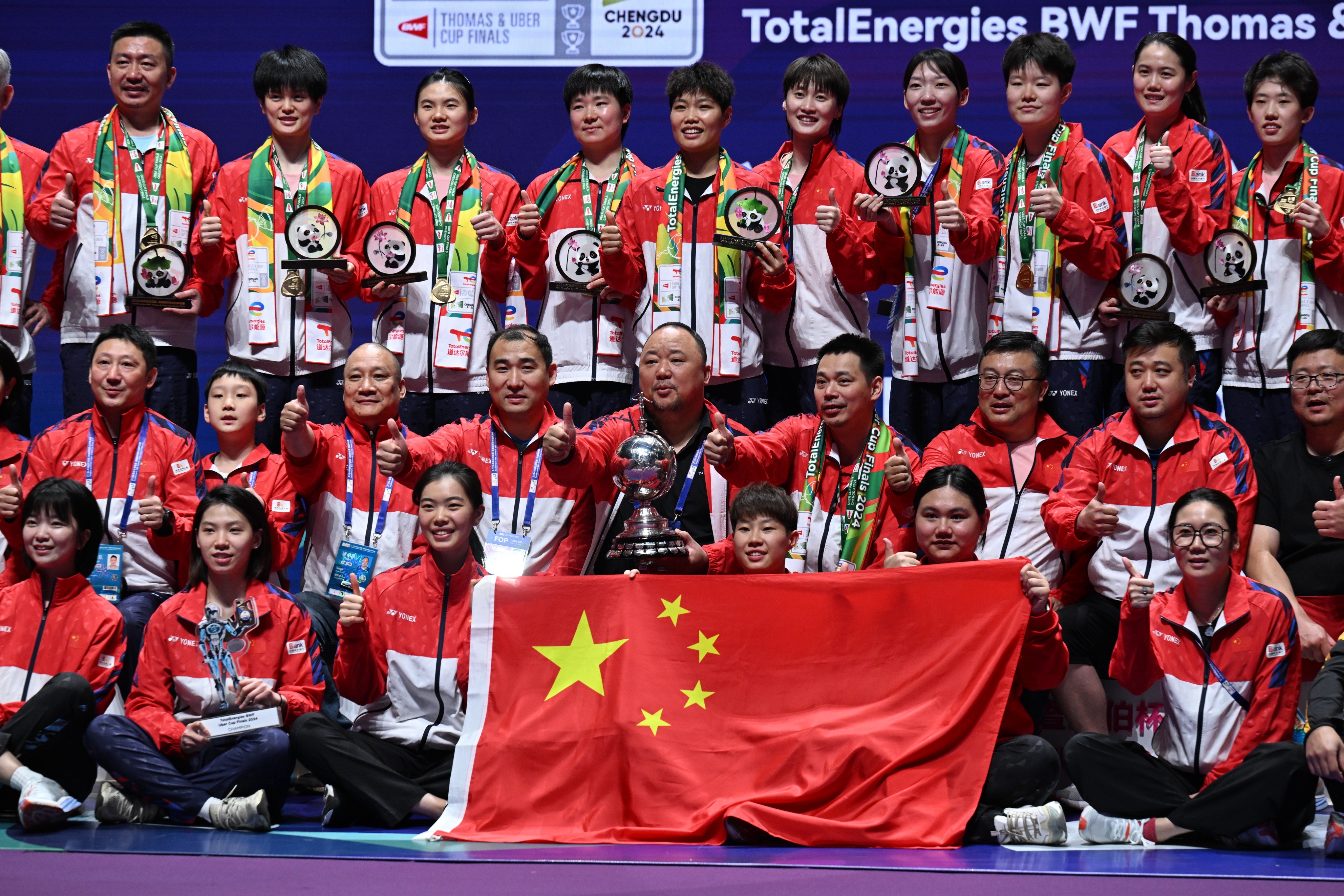 China Badminton Association president Zhang Jun (middle, with trophy) celebrates with Team China after winning the Uber Cup in May 2024. Photo: Getty Images