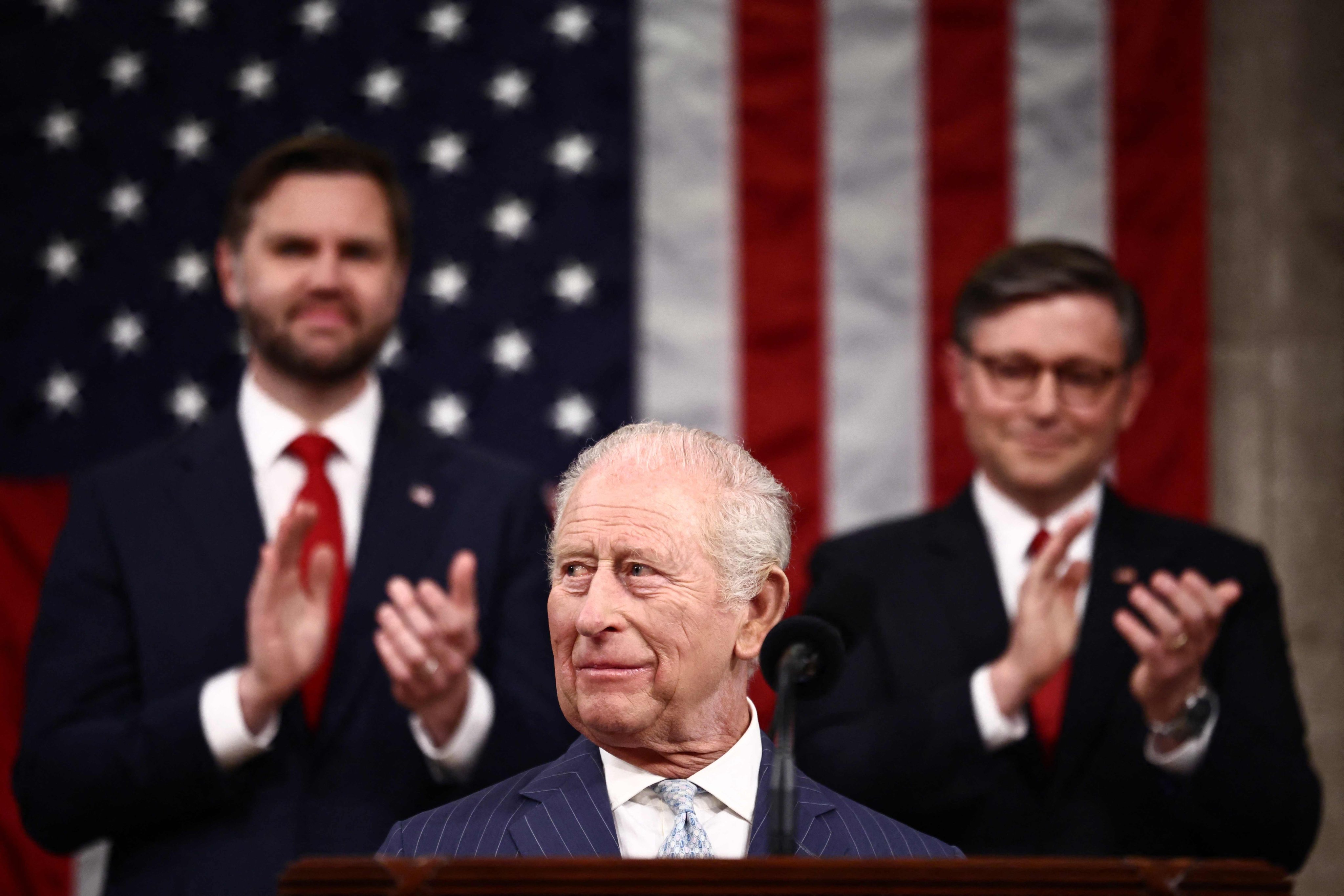 US Vice-President J.D. Vance and House Speaker Mike Johnson applaud King Charles before his address to a joint session of Congress. Photo: AFP