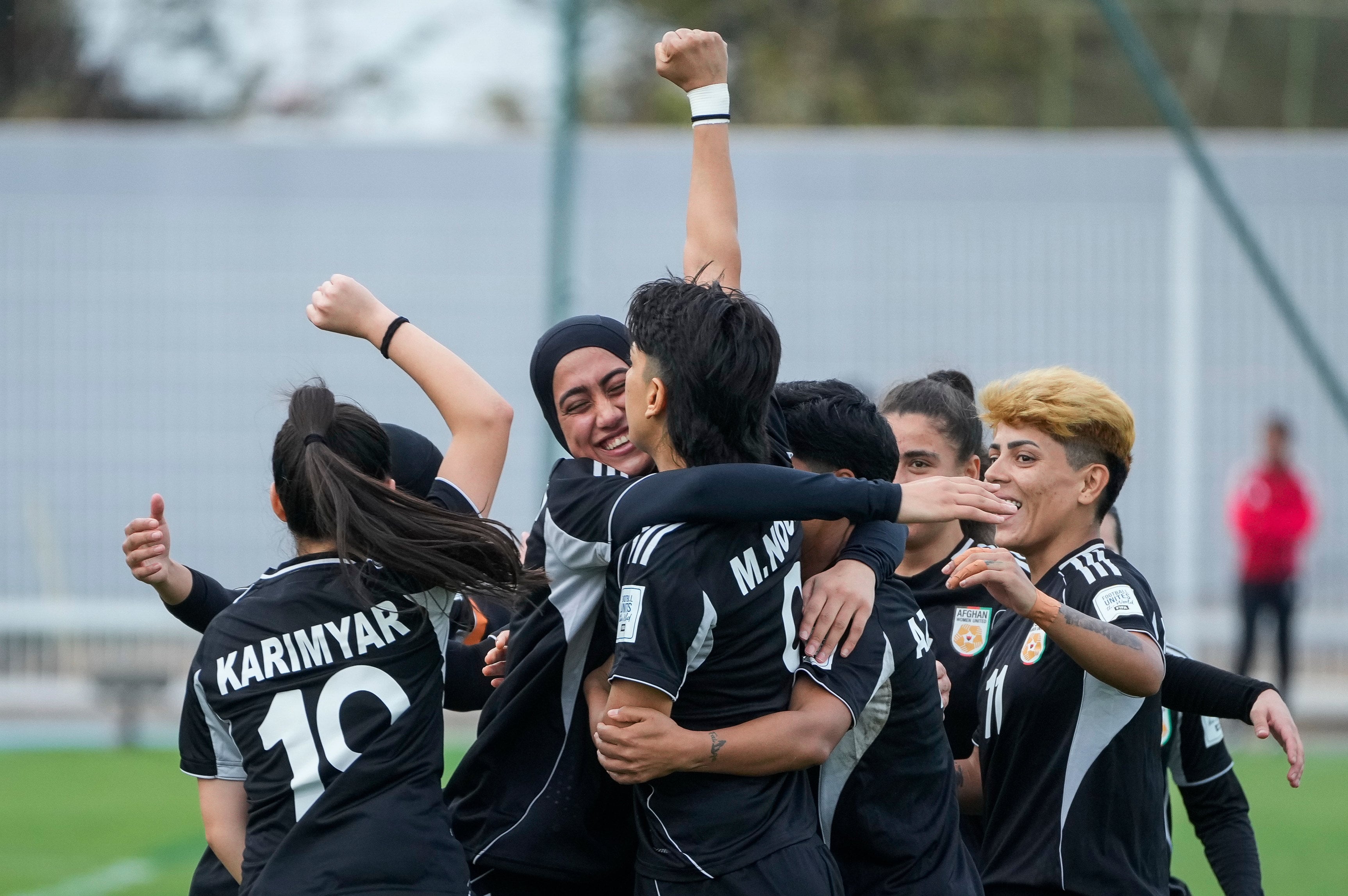 Members of Afghan Women United celebrate after scoring against Chad, in their first international tournament since fleeing their country. Photo: AP