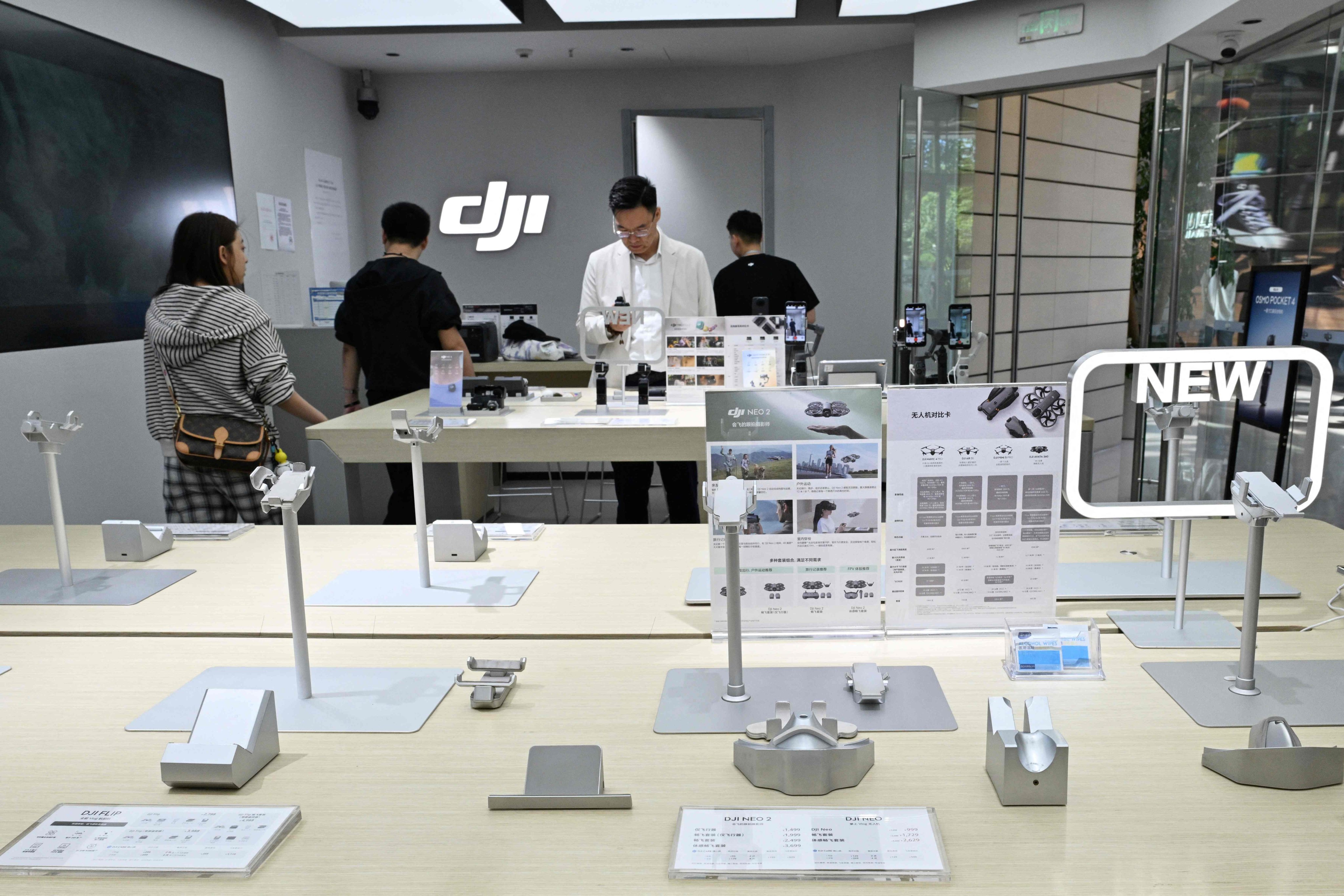 Empty display stands for drones are seen at a DJI store at a mall in Beijing on April 29, 2026. Photo: AFP