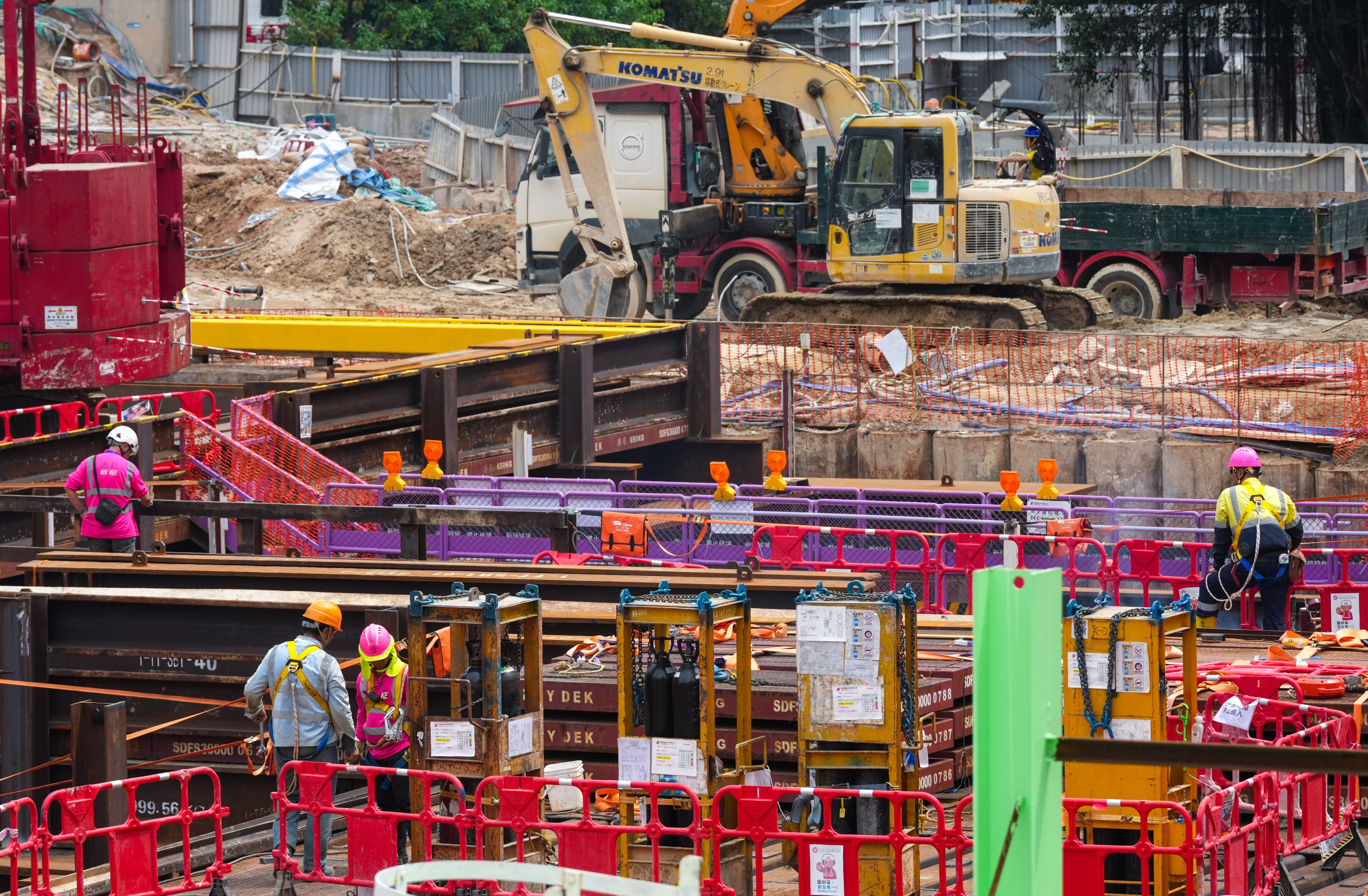 Workers are seen at a construction site in Mong Kok on March 24. Photo: Jelly Tse