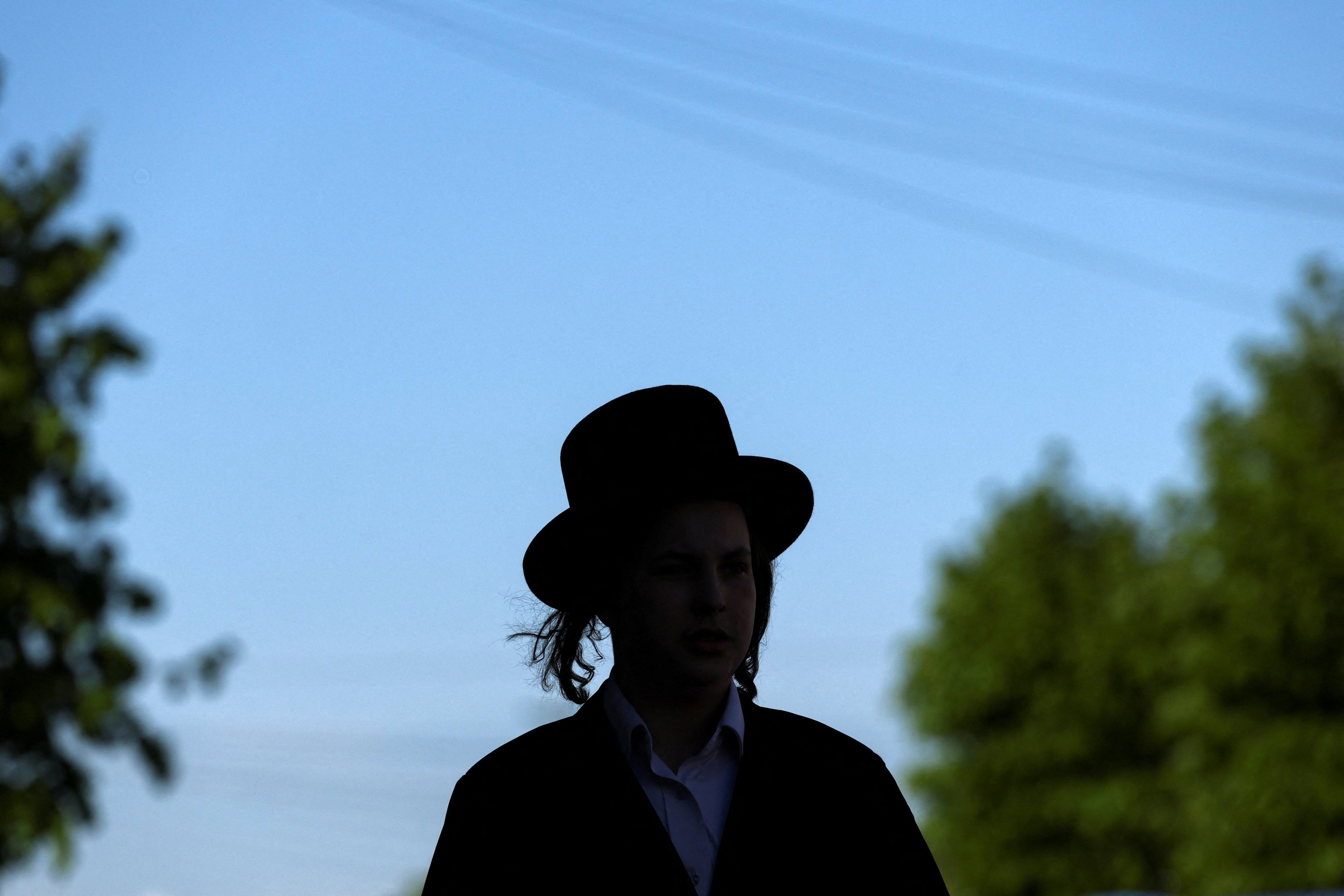 An Orthodox Jew walks near the scene where a man was arrested, in the Golders Green area, which is home to a large Jewish population, in London. Photo: Reuters