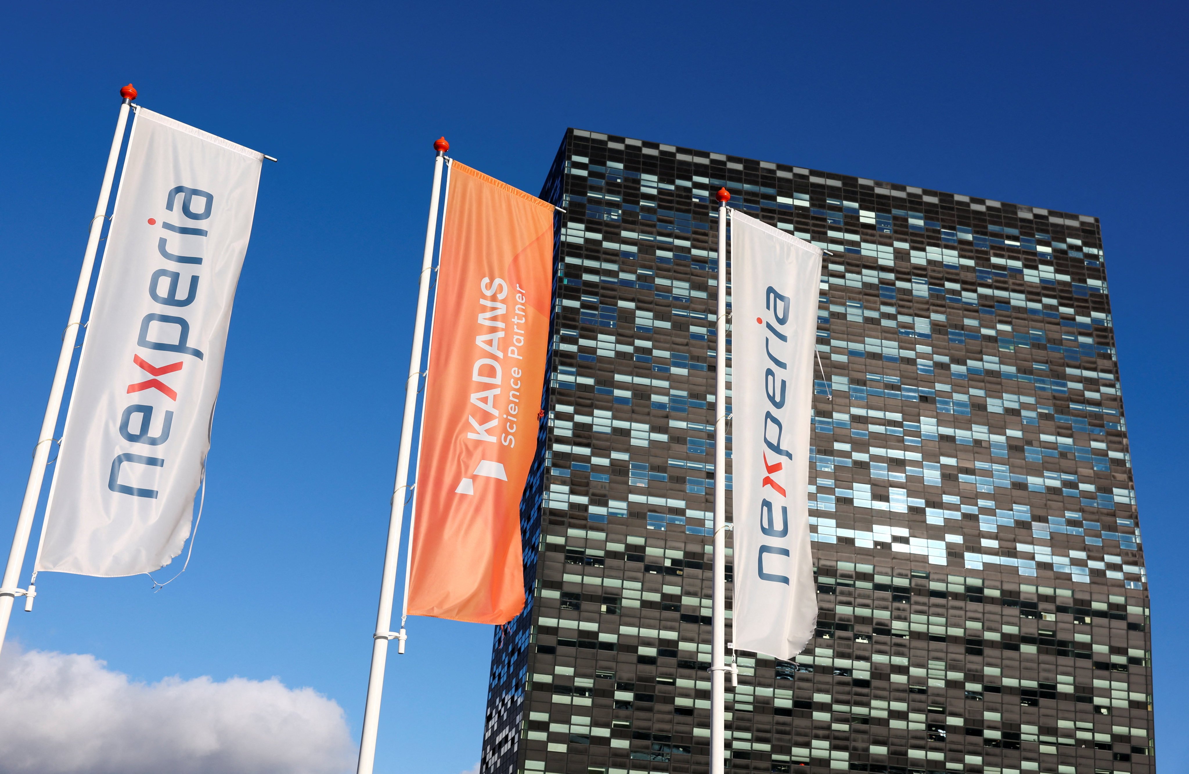 Flags flutter in front of the headquarters of Nexperia in Nijmegen, the Netherlands, January 14 2026. Photo: Reuters