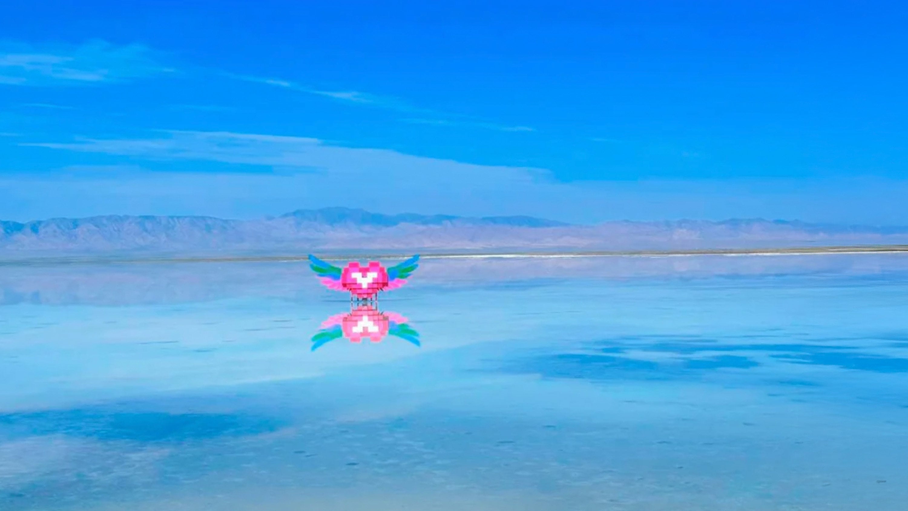 The Chaka Salt Lake in China, which is known as the “Mirror of the Sky,” features a winged heart brick sculpture that has sparked criticism for disrupting the lake’s serene beauty. Photo: RedNote