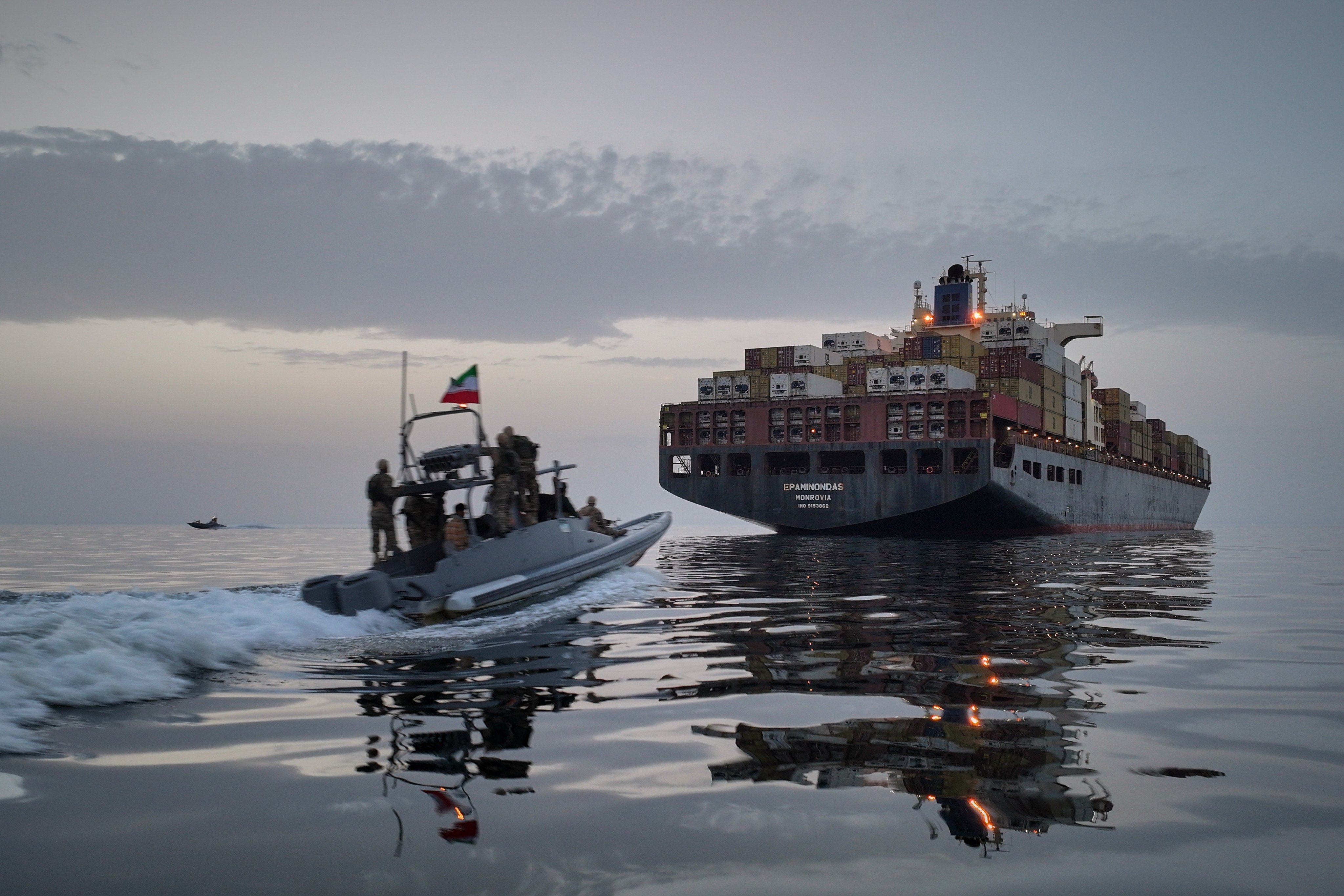 An Iranian Revolutionary Guard Navy speedboat approaches the cargo ship Epaminondas during what state media described as the seizure of one of two vessels accused of violations in the Strait of Hormuz on April 21. Photo: Tasnim News Agency via AP