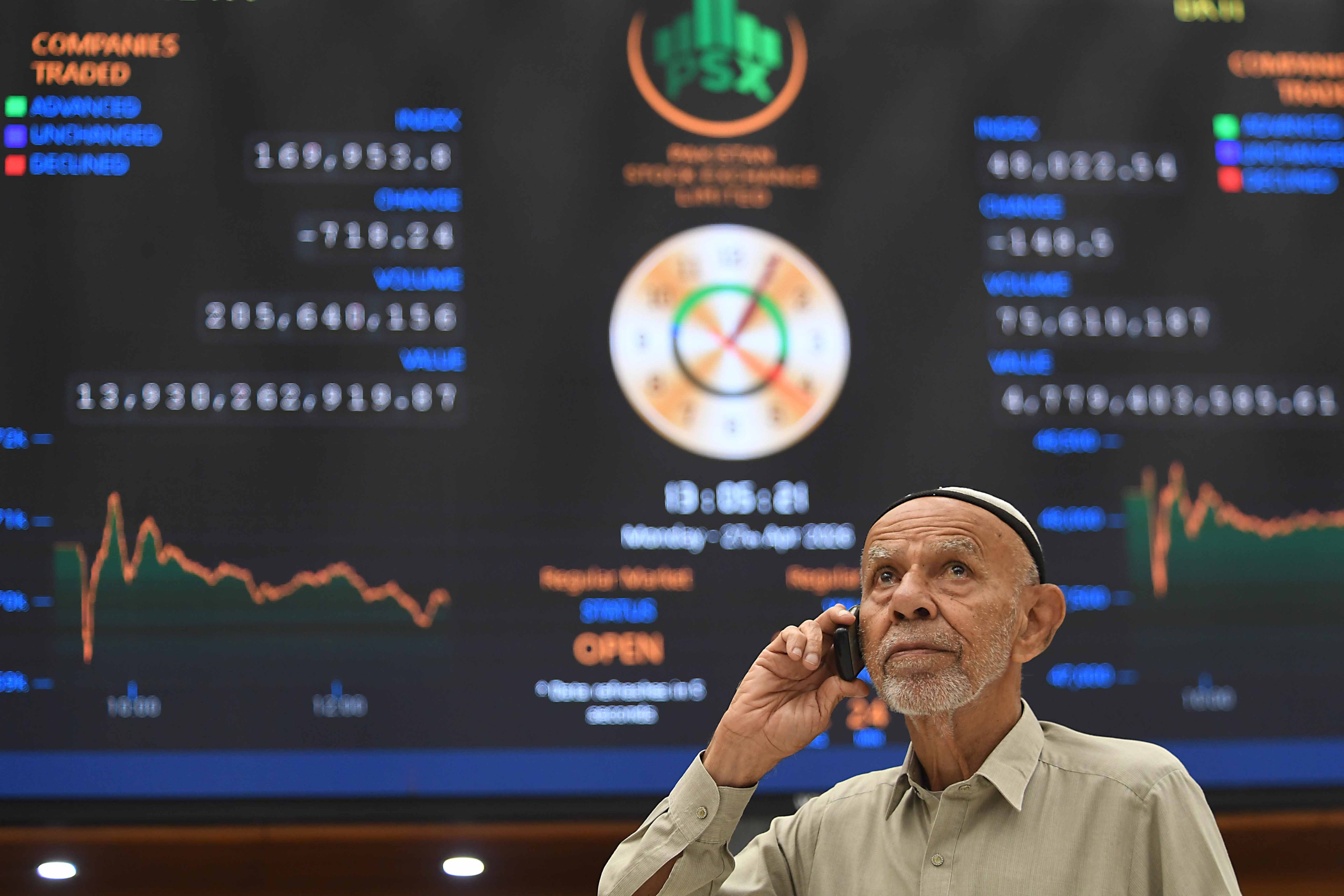 A trader monitors share prices at the Pakistan Stock Exchange (PSX) in Karachi, Pakistan, on Monday. Photo: EPA