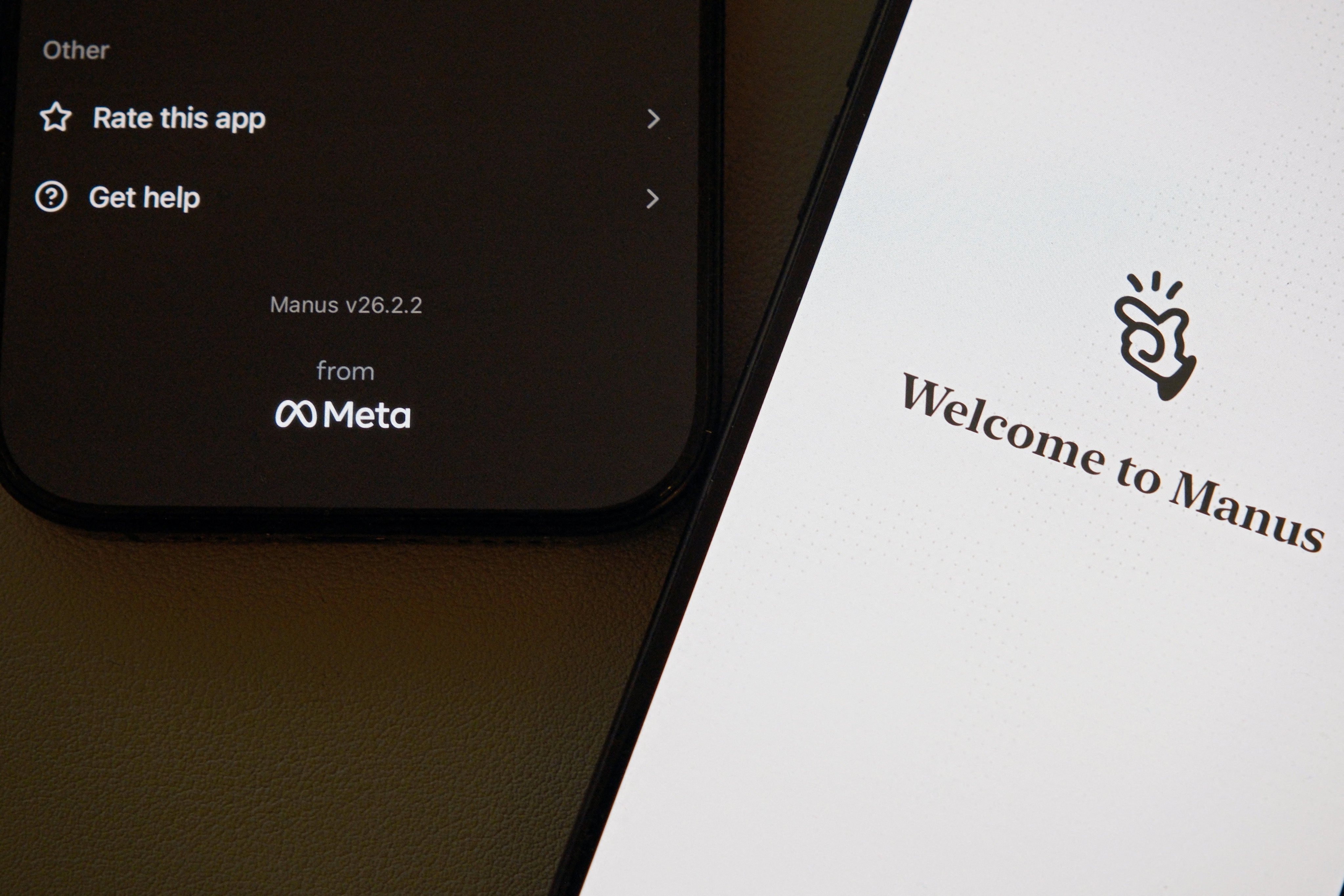 The Manus AI agent app is displayed on mobile phones with the logo of US tech giant Meta in the app interface. Photo: Reuters