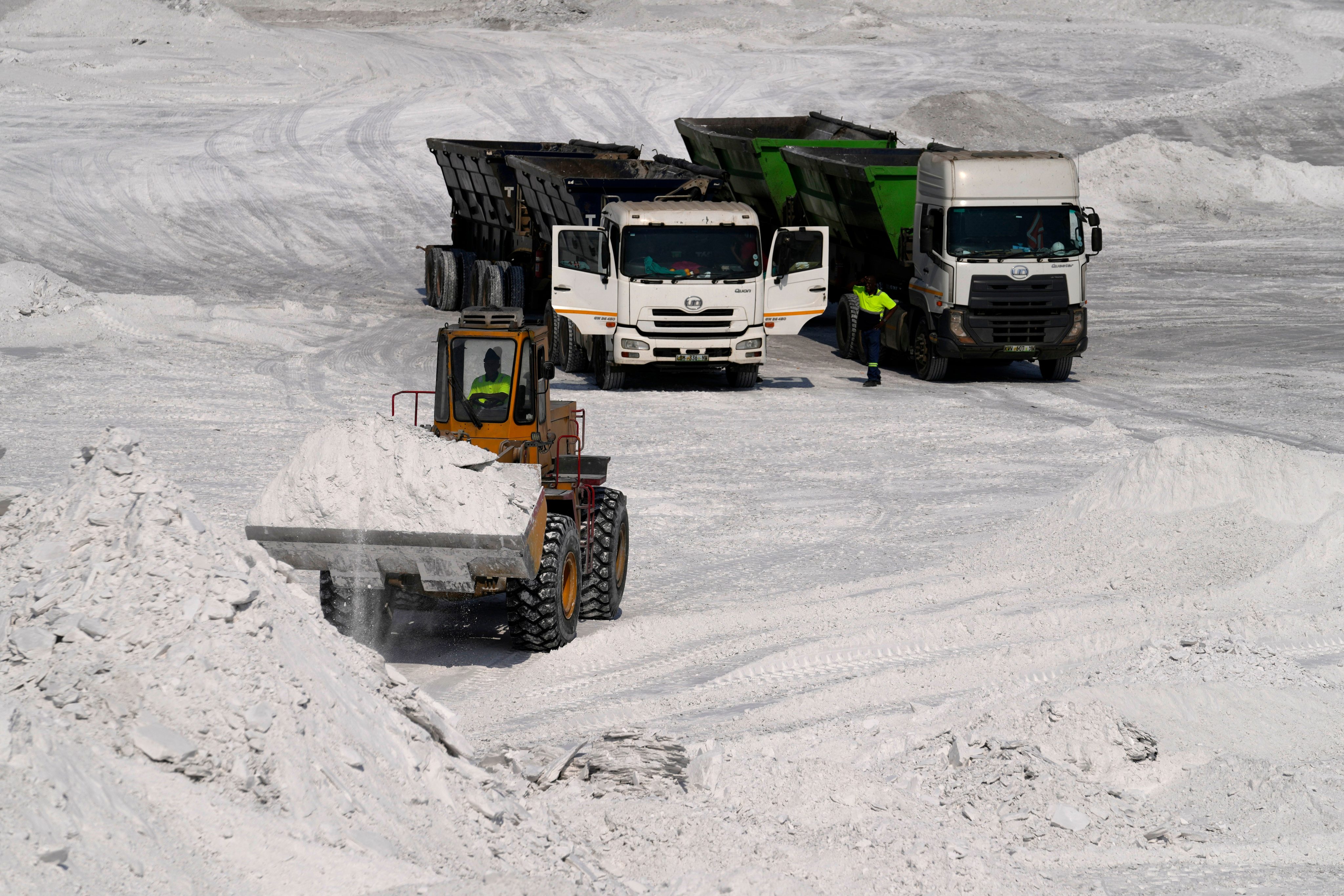 A front-end loader transports phosphogypsum in Phalaborwa, South Africa, site of a US-funded rare earths project. Photo: AP