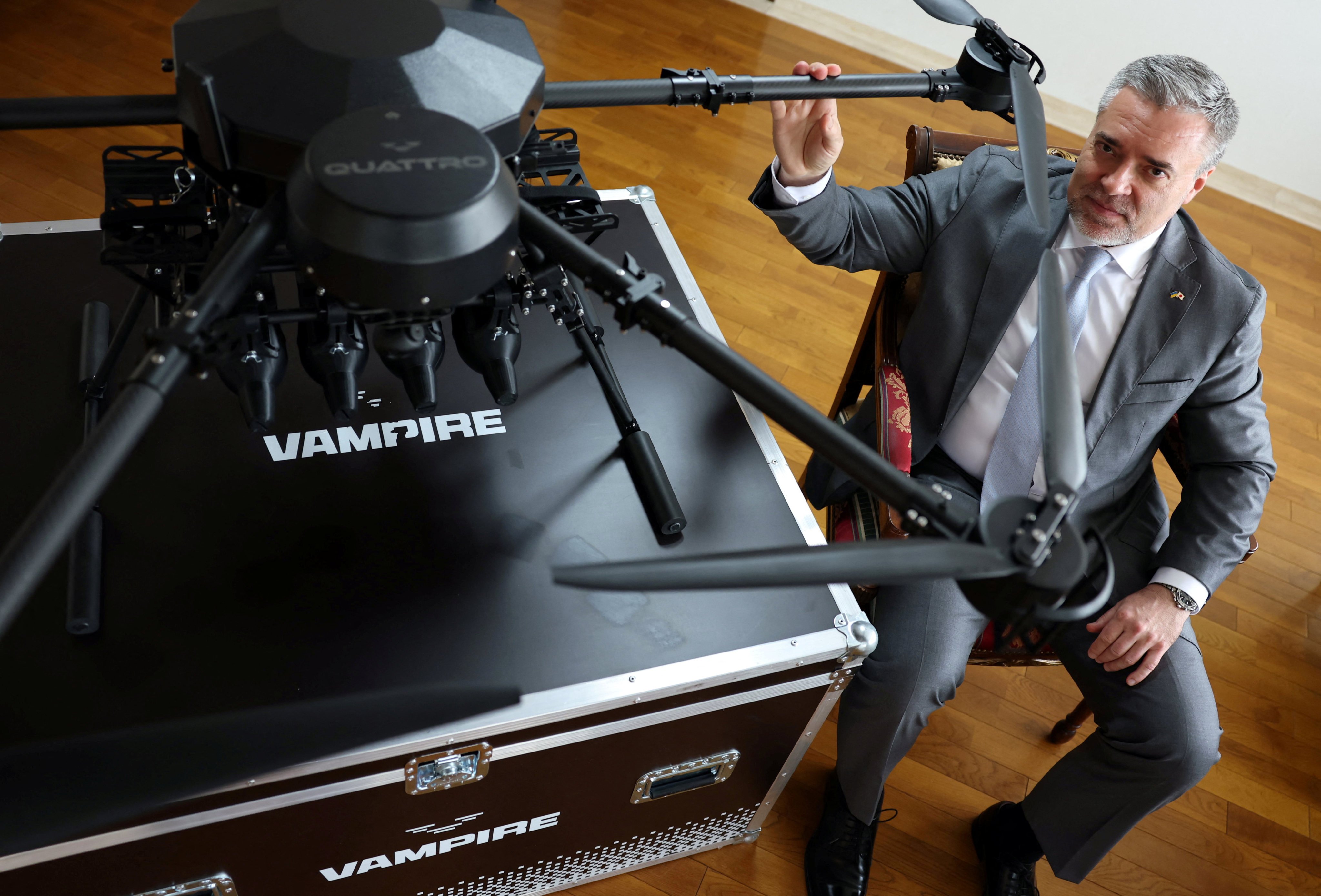 Ukraine’s Ambassador to Japan Yurii Lutovinov poses next to a mockup of a Ukrainian-made Vampire drone during an interview at the Ukraine Embassy in Tokyo, Japan on Tuesday. Photo: Reuters
