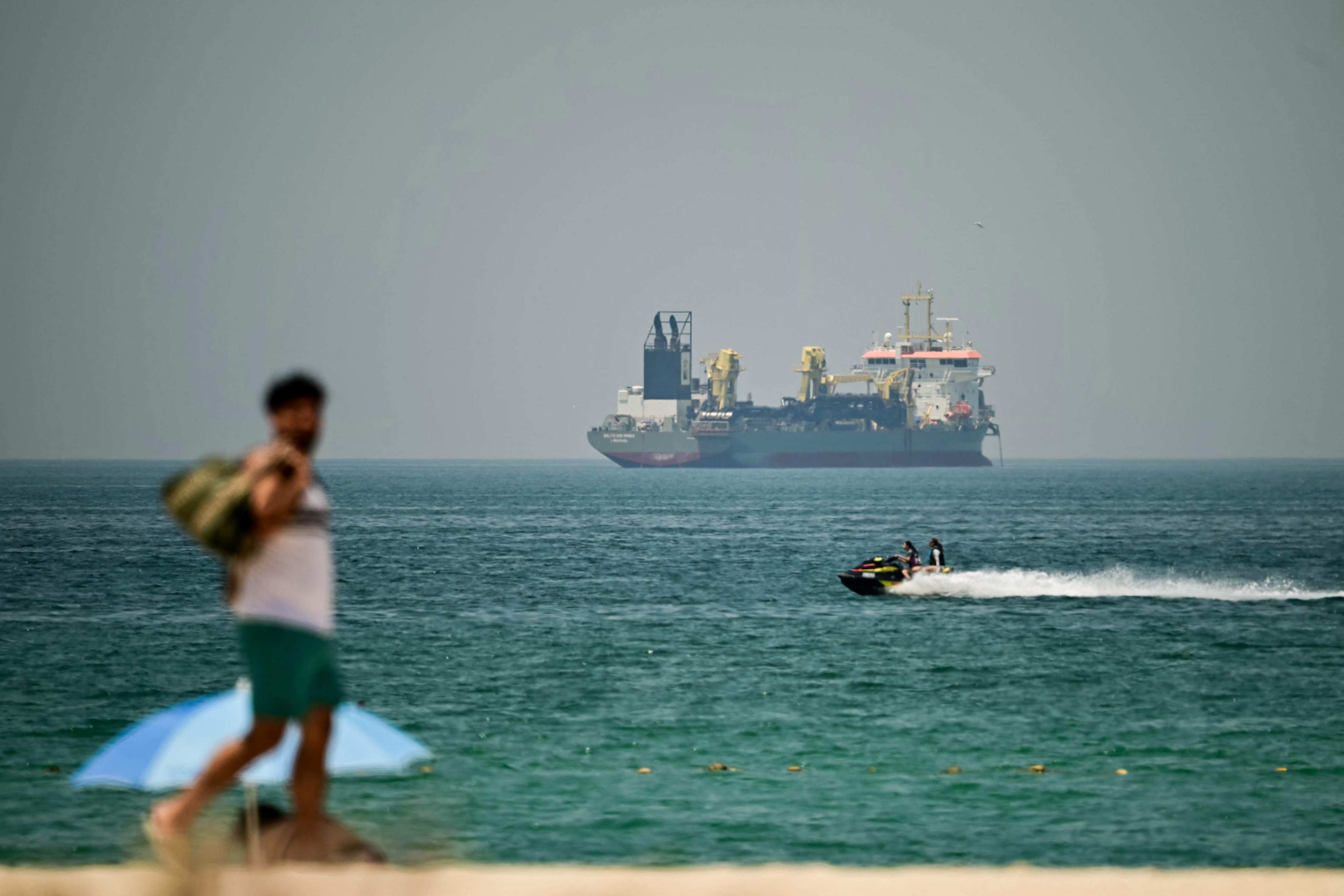 A commercial vessel is seen off the coast of Dubai on April 20. Photo: AFP