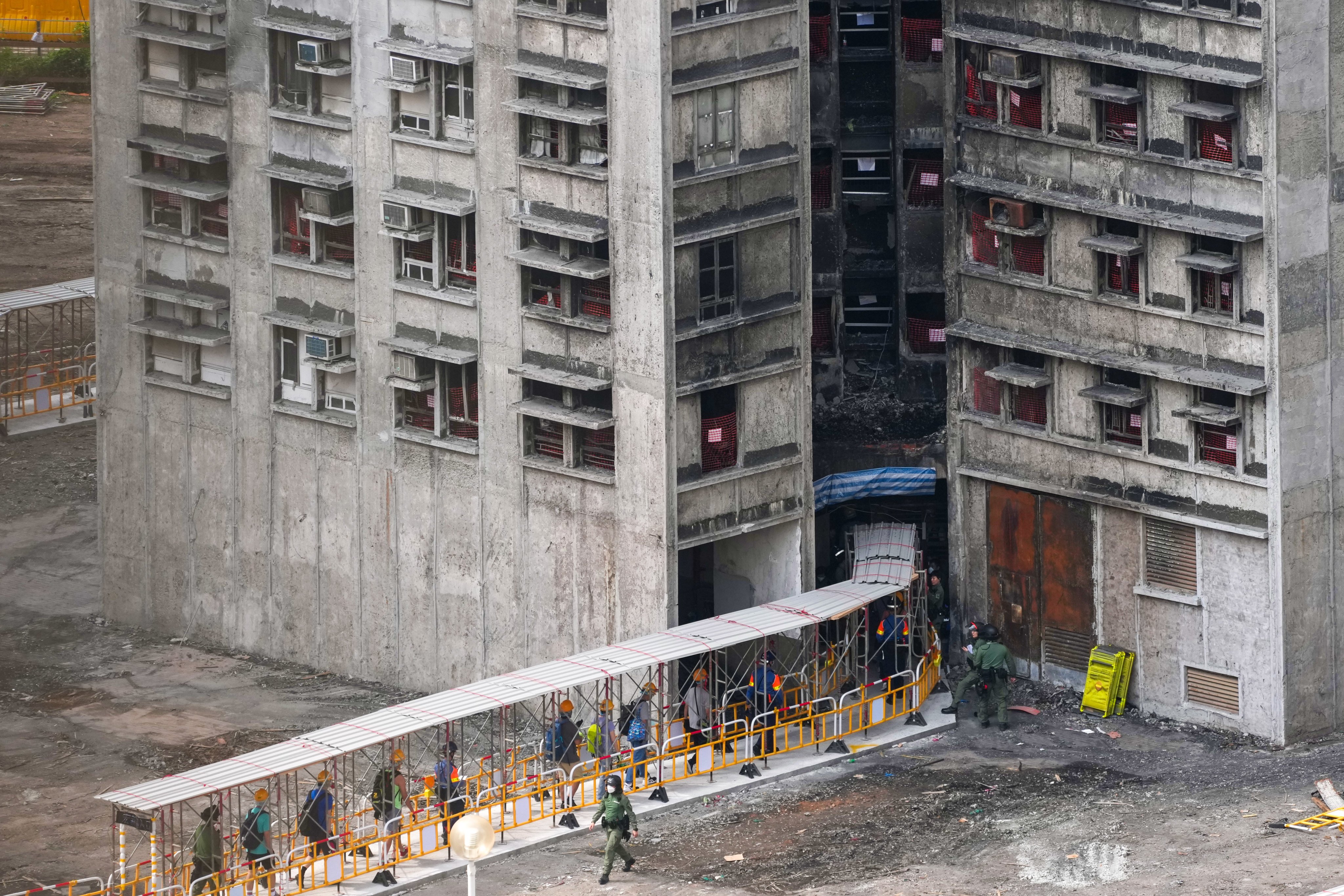 Residents return to the estate to collect their belongings. Photo: Karma Lo