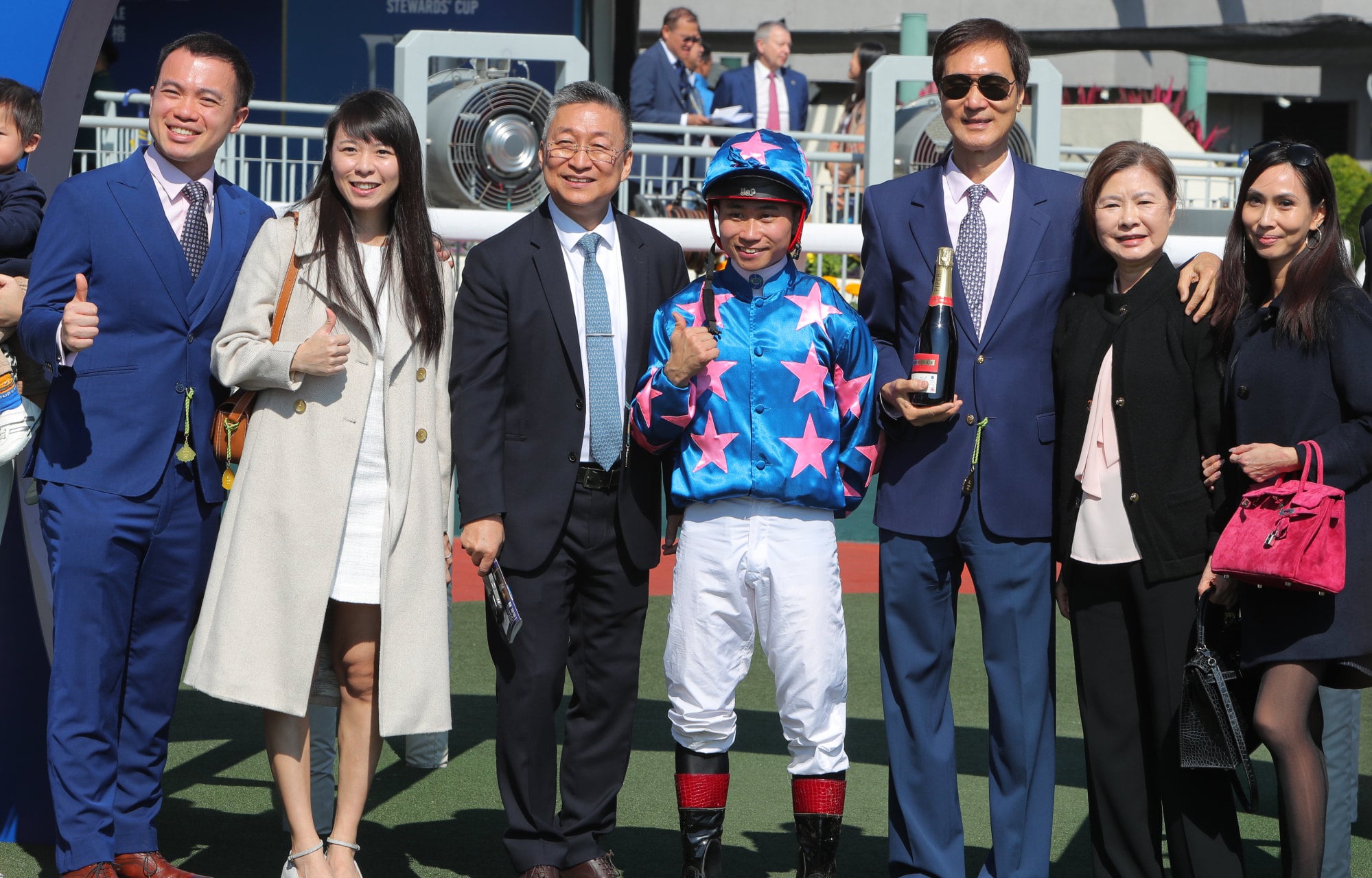 Dylan Mo and connections celebrate the triumph of Winning Wing.