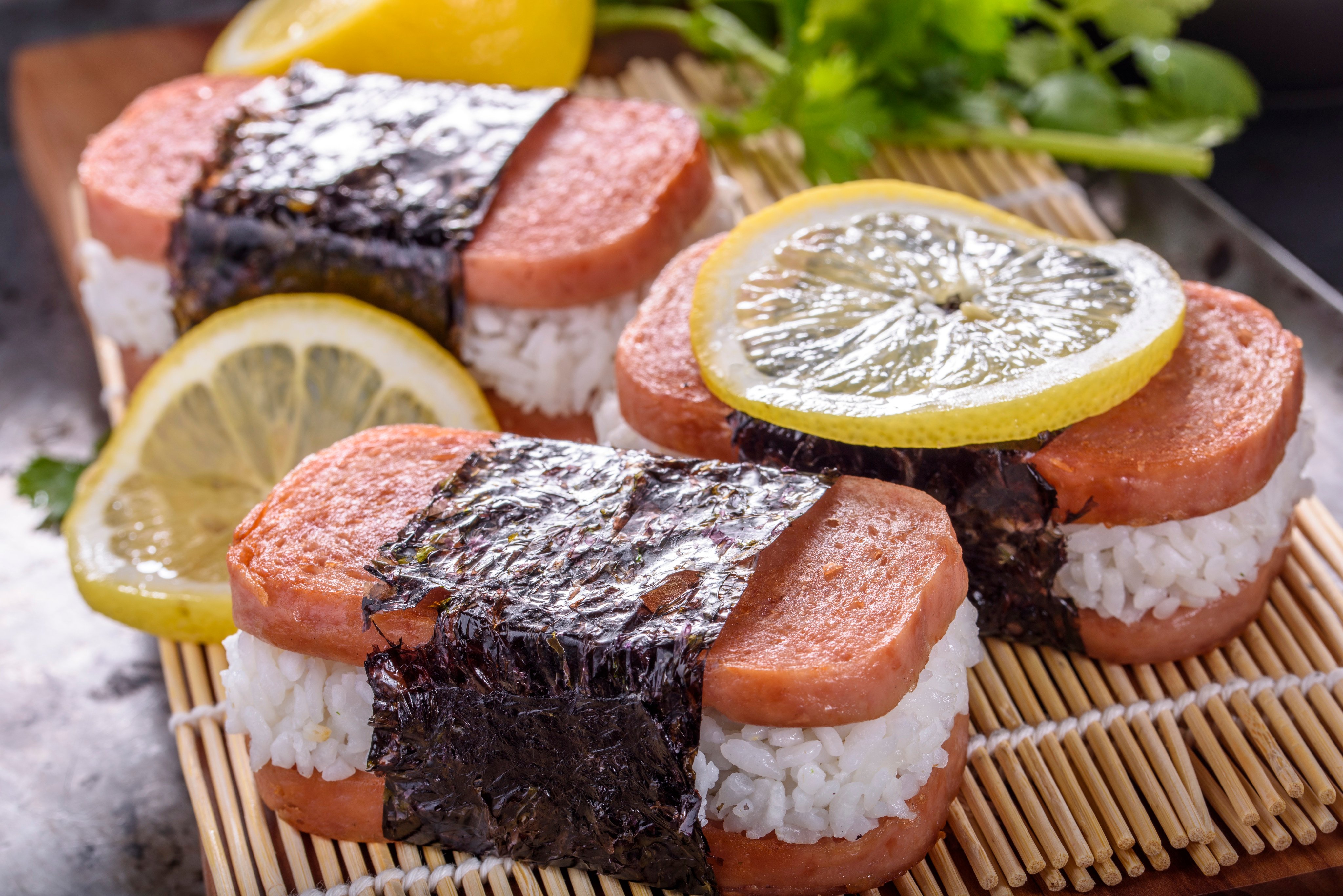 People in Okinawa transformed US dishes and ingredients such as Spam into beloved local food items, like Spam musubi (pictured). Photo: Getty Images