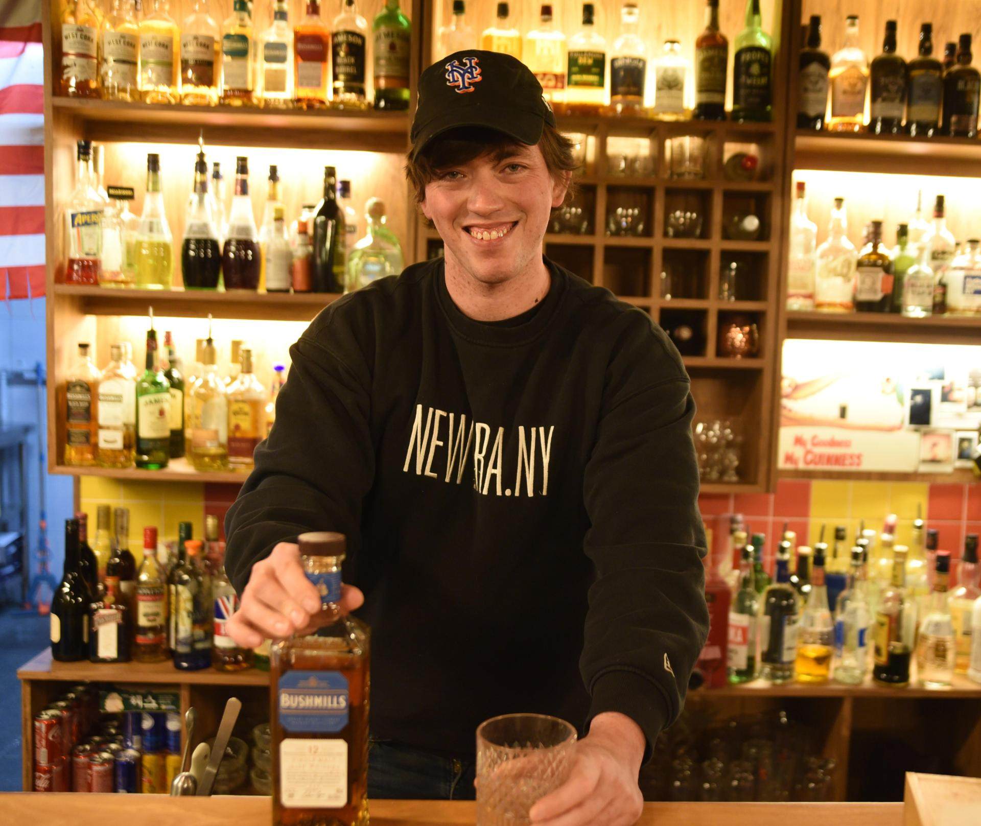 Brendan Kelly stands behind the bar at Kelly’s Pub in Seoul’s Nonwon district. The Irish-American expat shares how his bar attracts locals and “foreigners from all over the world” as the face of the neighbourhood changes. Photo: Korea Times