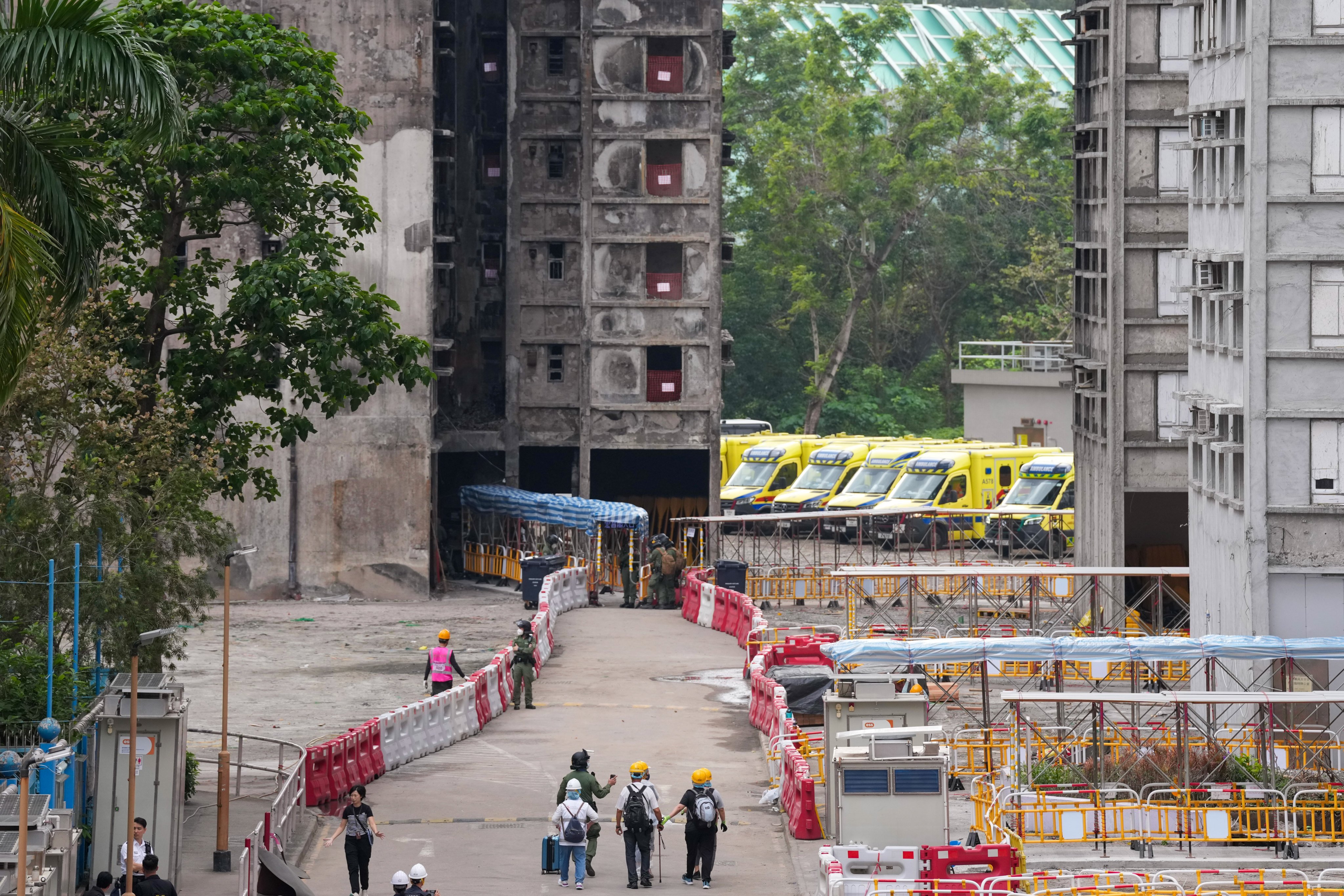 Residents return to the estate to collect their belongings. Photo: Karma Lo