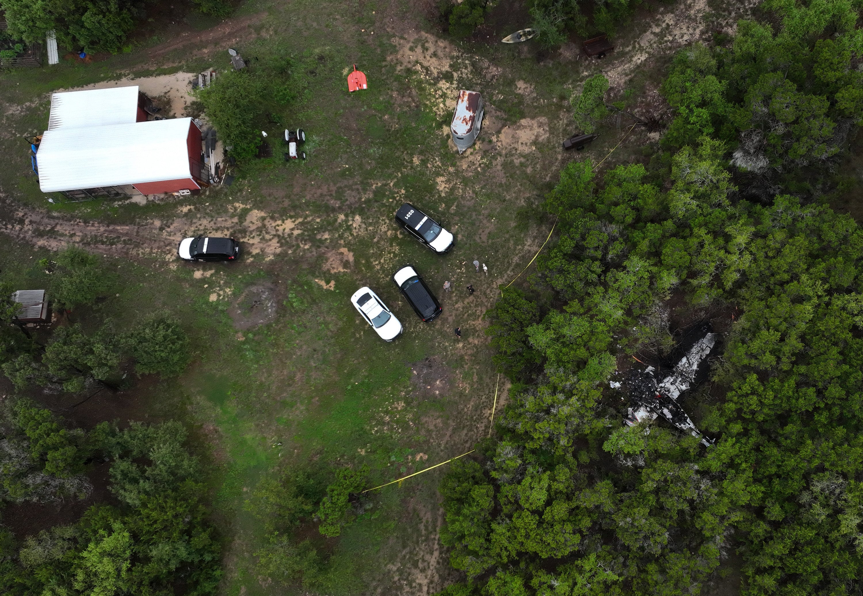 A crashed Cessna airplane in a wooded area on Round Rock Road in Wimberley, Texas on Friday. Photo: via AP