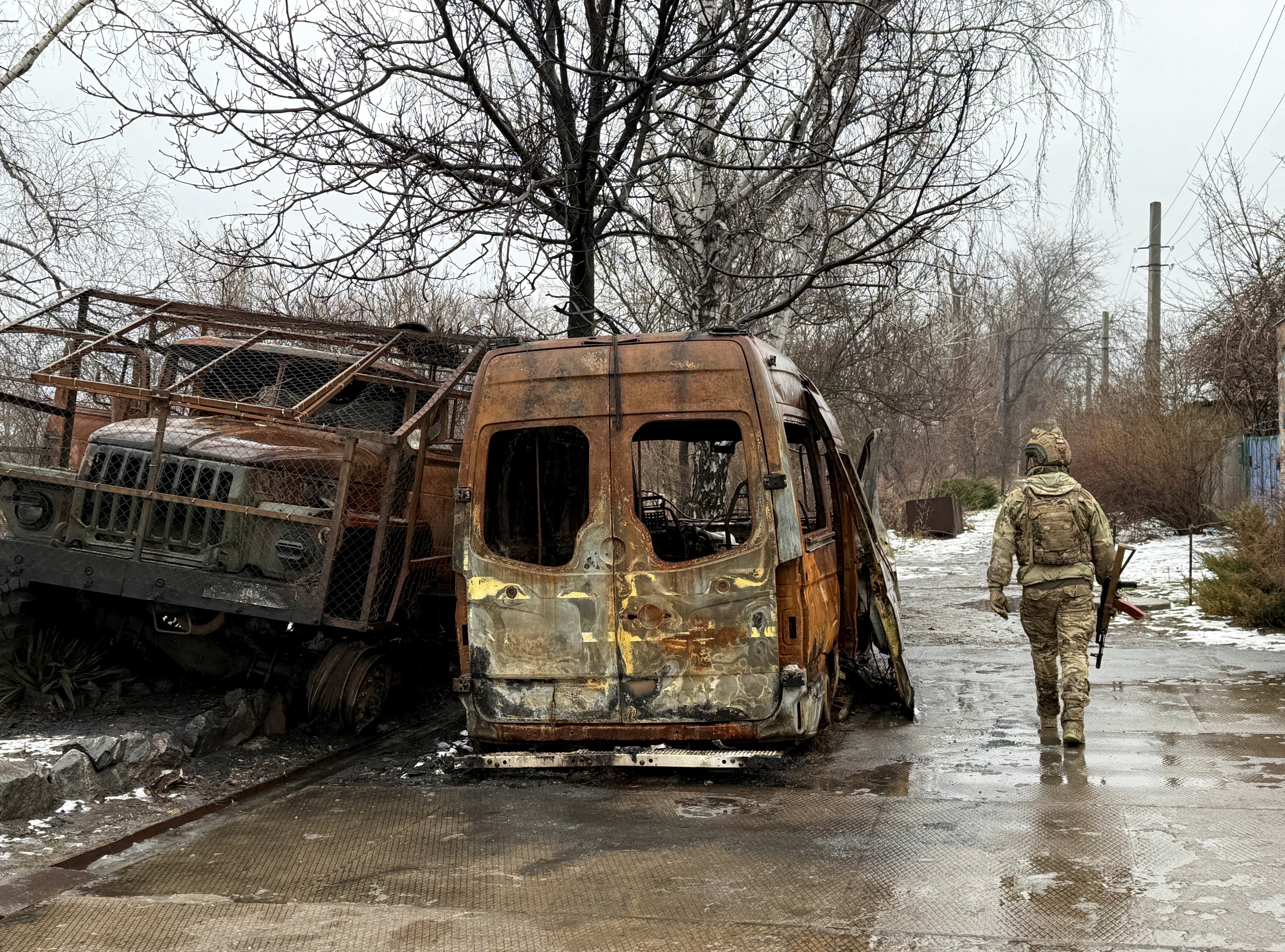 A service member of the 93rd Kholodnyi Yar Separate Mechanized Brigade of the Ukrainian Armed Forces walks on a road near destroyed cars, amid Russia’s attack on Ukraine, in the frontline town of Kostiantynivka in Donetsk region, Ukraine, on February 19. Photo: Reuters