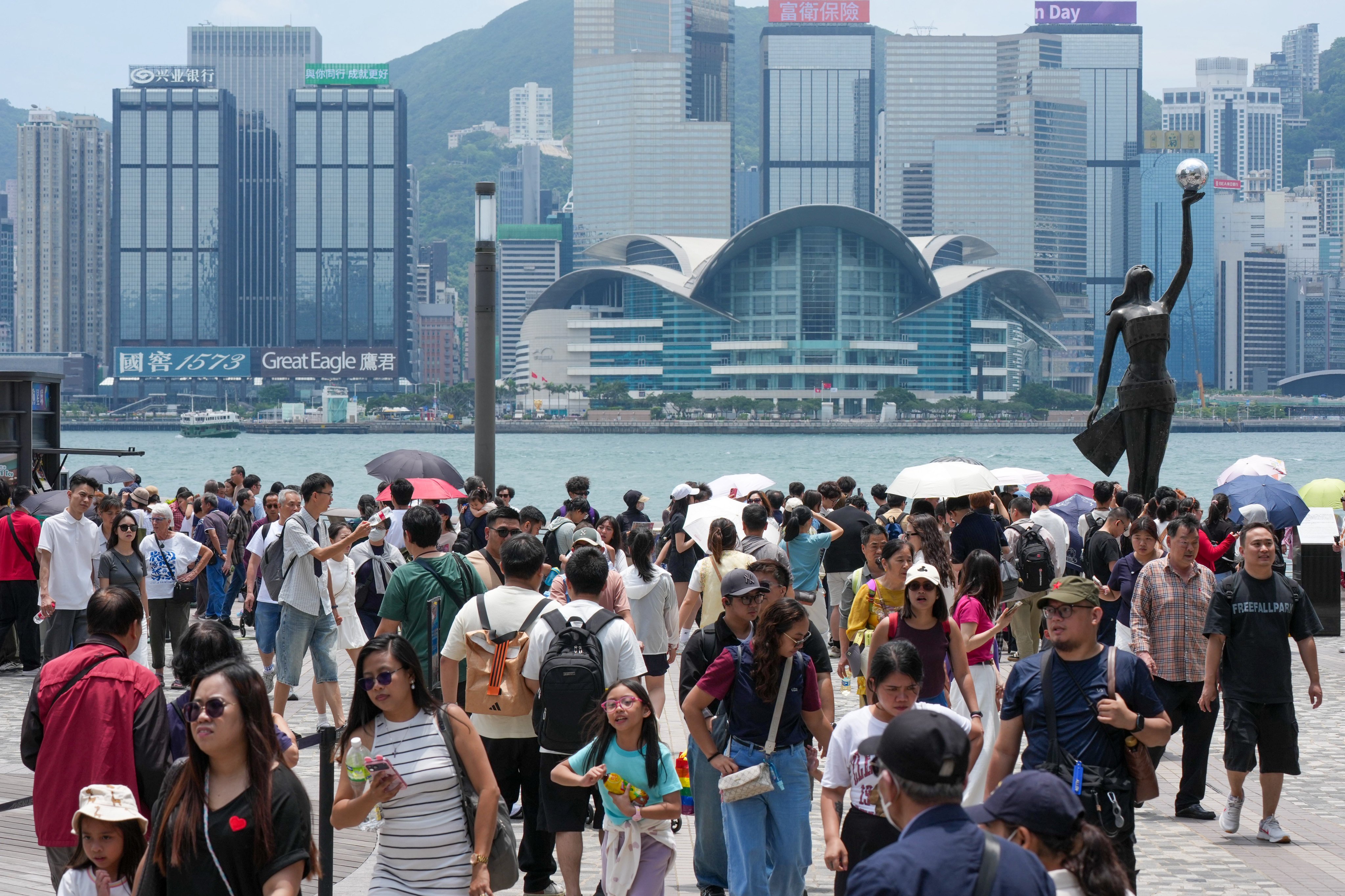 Tourists visit the Tsim Sha Tsui waterfront on the first day of mainland China’s “golden week” Labour Day holiday. Photo: Jelly Tse