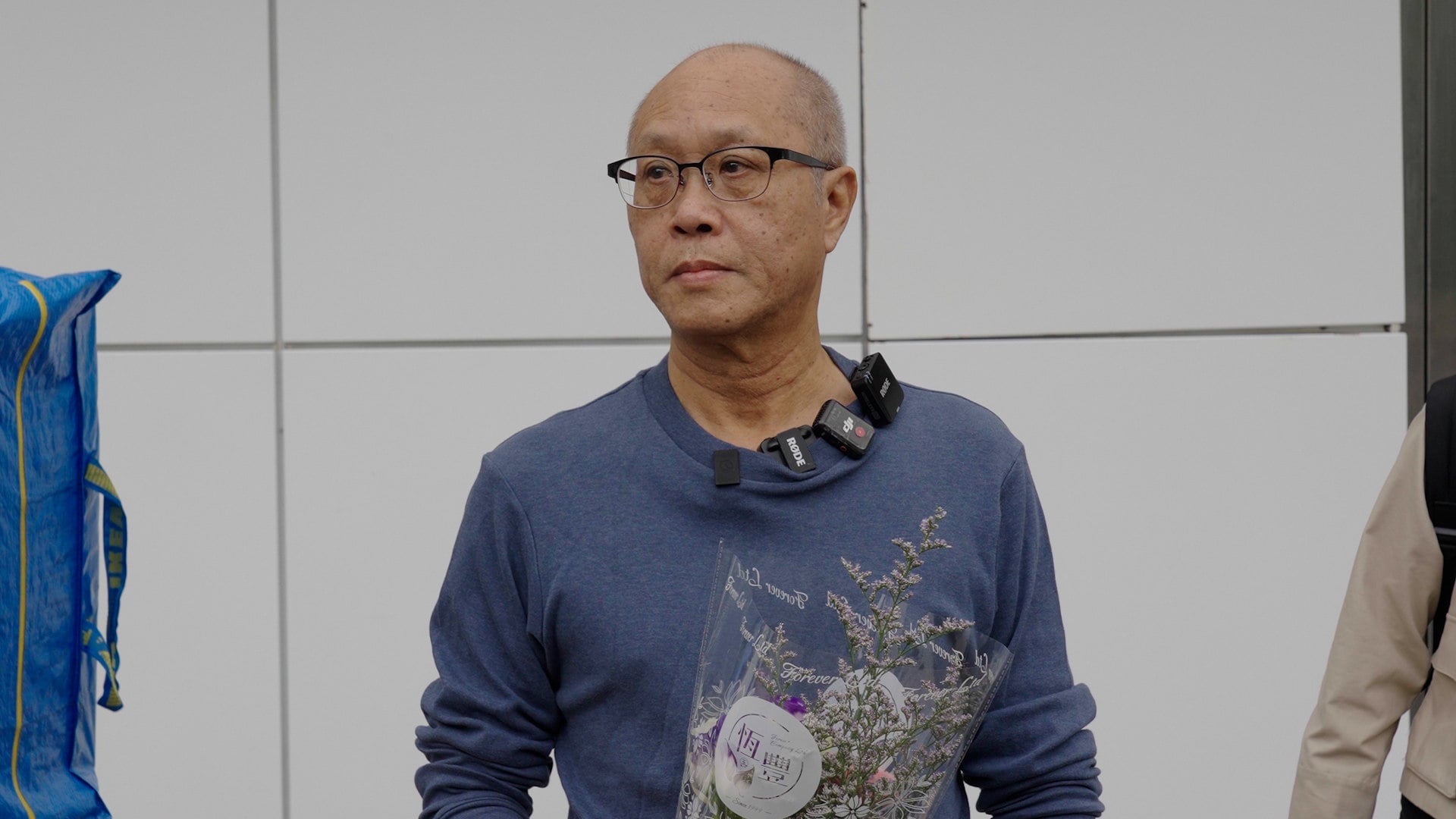 Video thumbnail for Yip’s story:
Wang Fuk Court resident brings bouquet for deceased wife upon return to home razed by fire