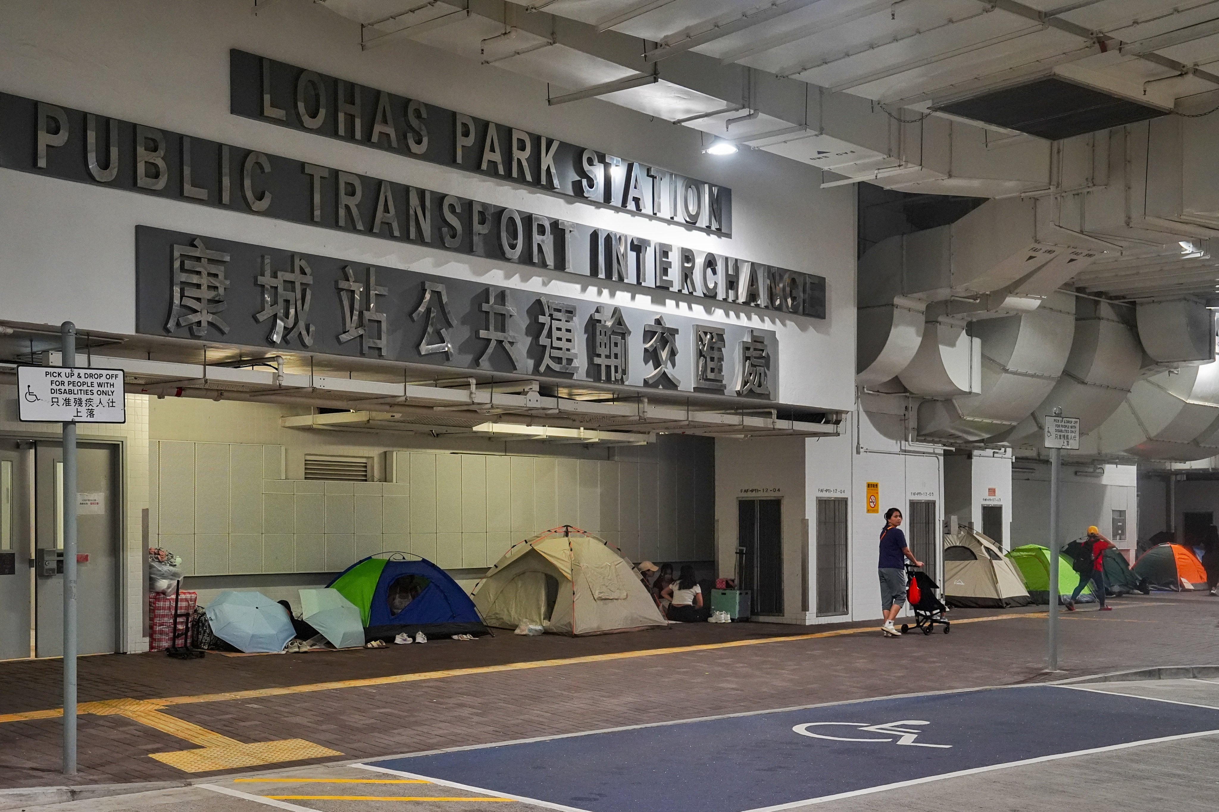 Domestic helpers gather at the Lohas Park Station Public Transport Interchange during the “golden week” holiday, citing a lack of public space leaving few options on their days off. Photo: Elson Li