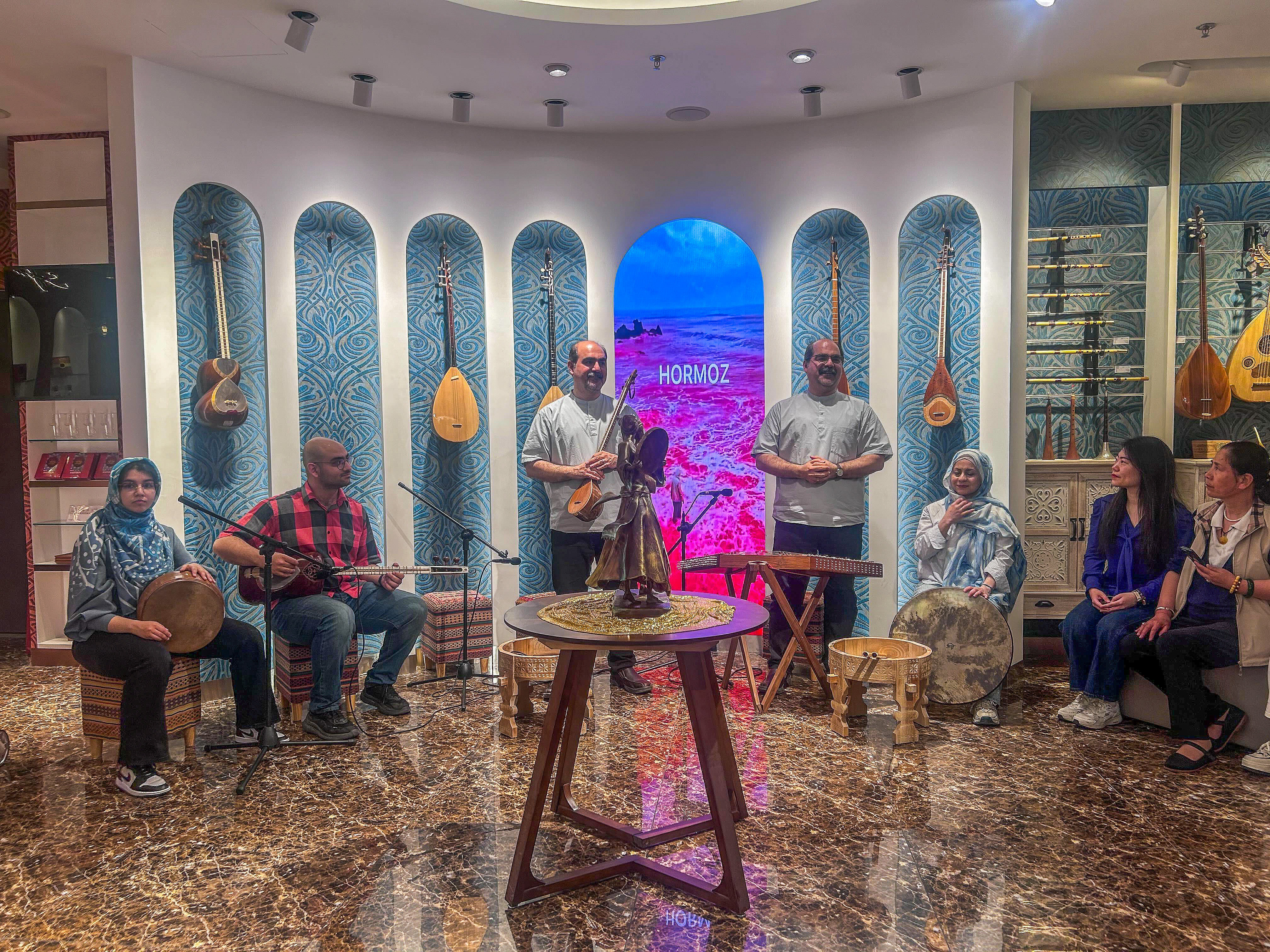 Majid and Massoud Shamaeezadah (standing) hold a concert at their music workshop in Beijing. Photo: Laura Zhou