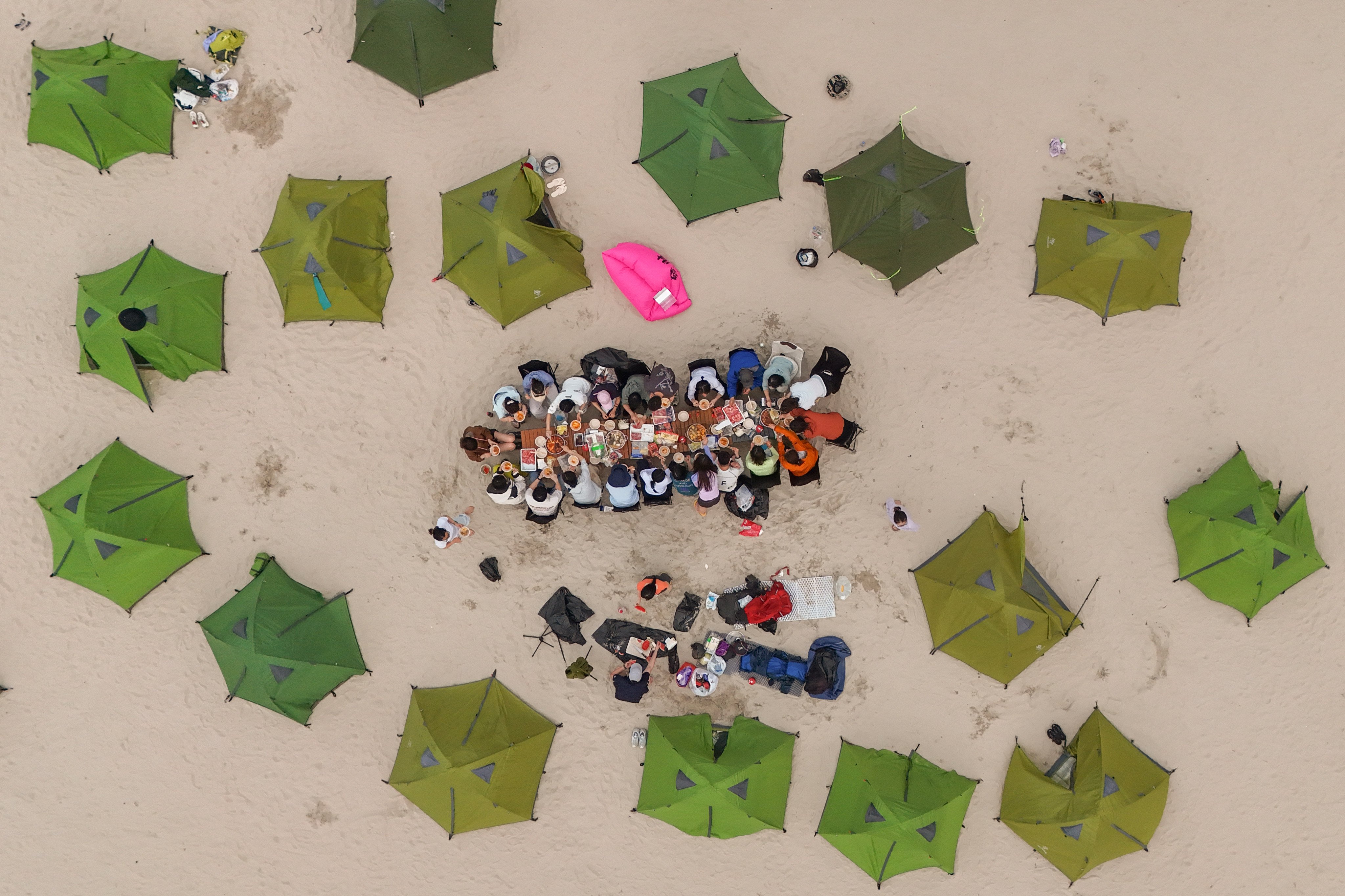 Members of an unlicensed tour group eat hotpot at the Ham Tin Wan campsite. Photo: Edmond So